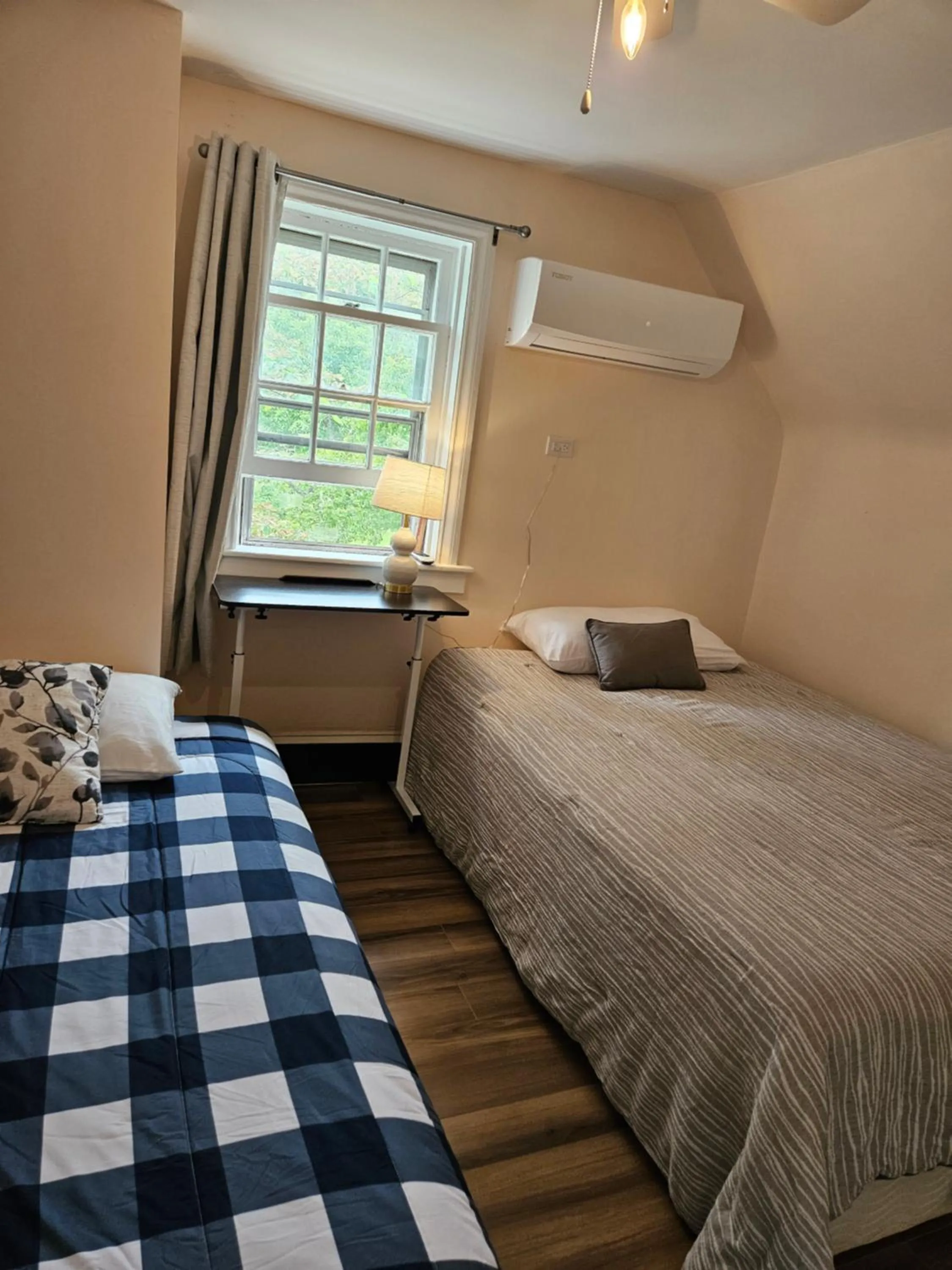 Bed in Sunflower Guest Suites