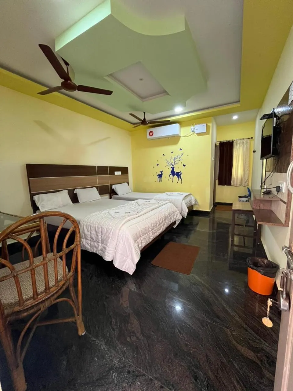 air conditioner, Bed in Sri Murugan Beach Paradise Hotel