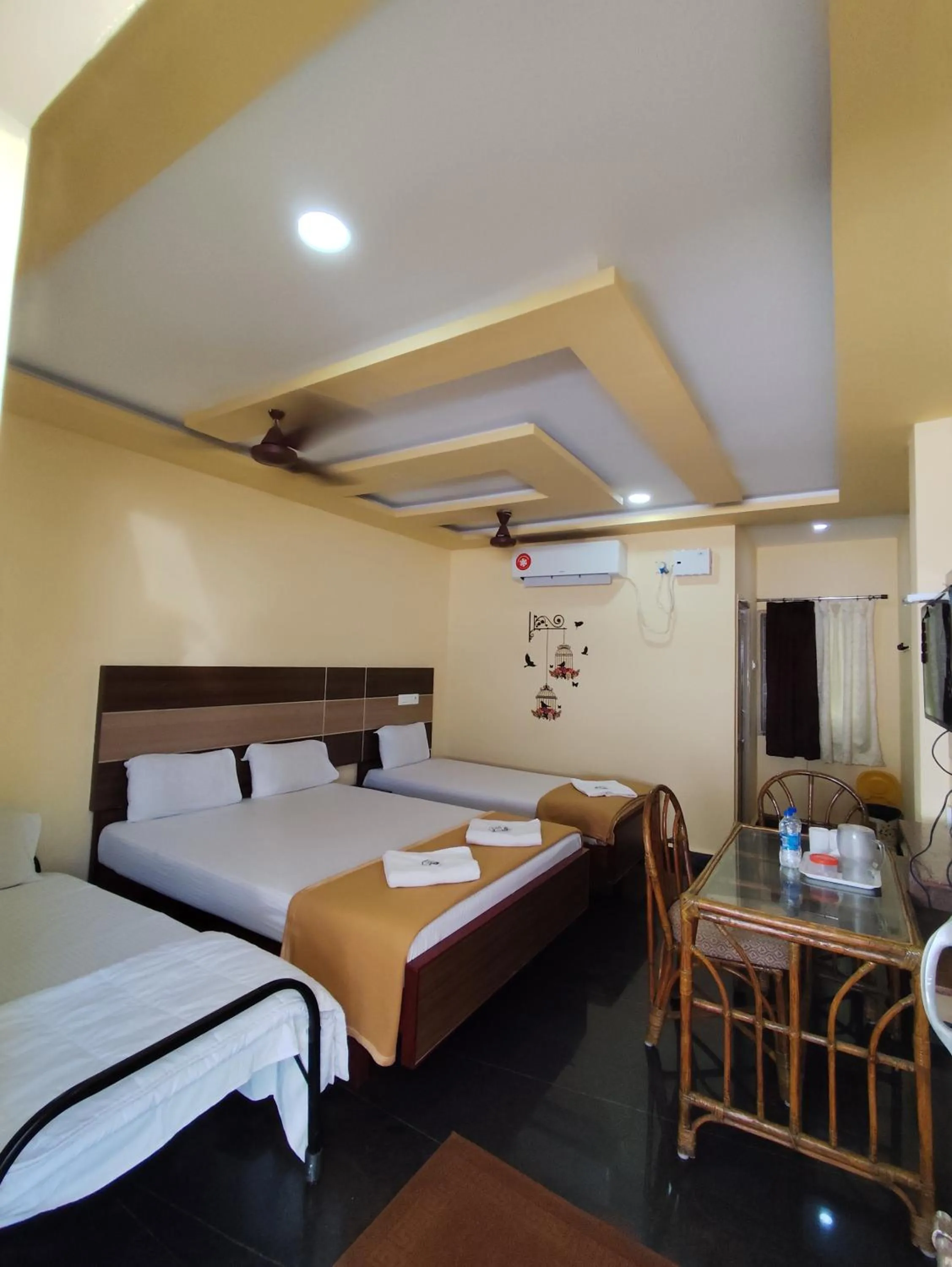 towels, Bed in Sri Murugan Beach Paradise Hotel