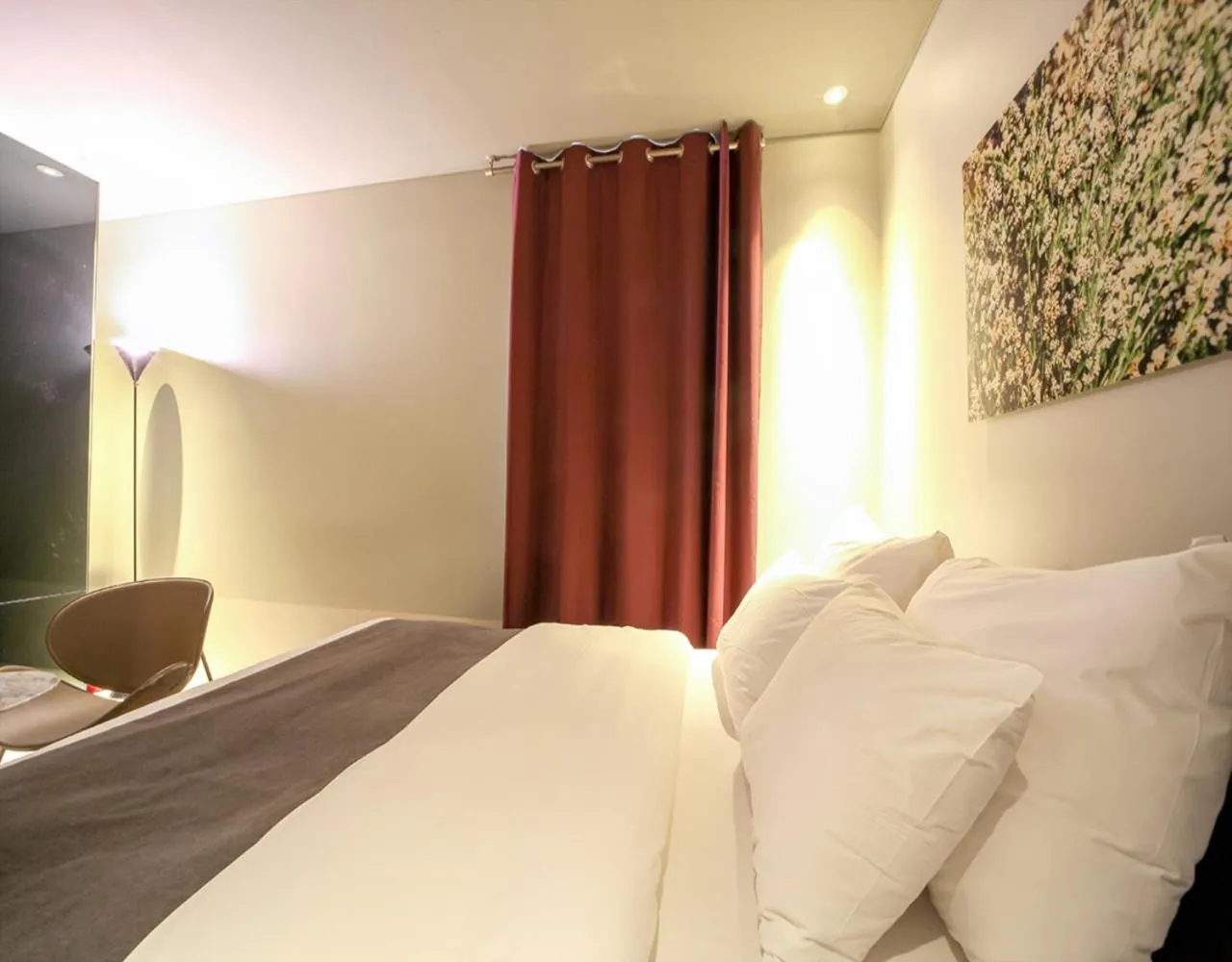 Bed in JS Boutique Hotel