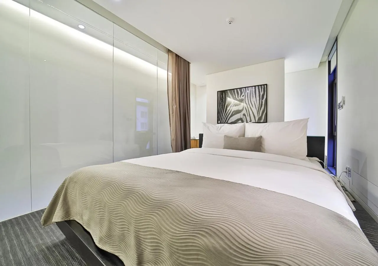 Bed in JS Boutique Hotel