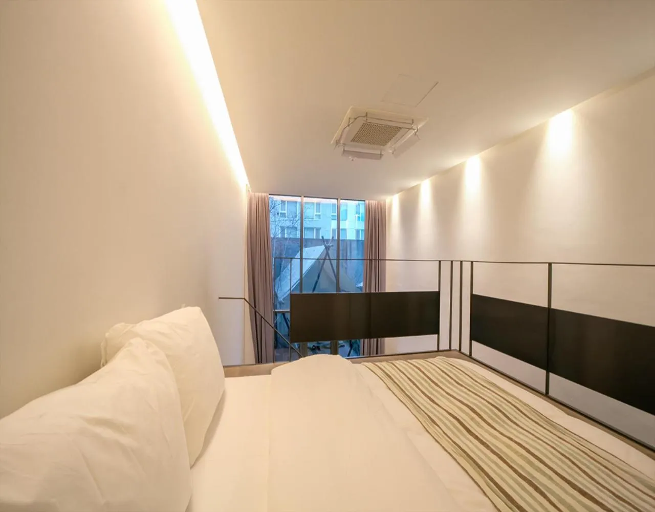 Bed in JS Boutique Hotel