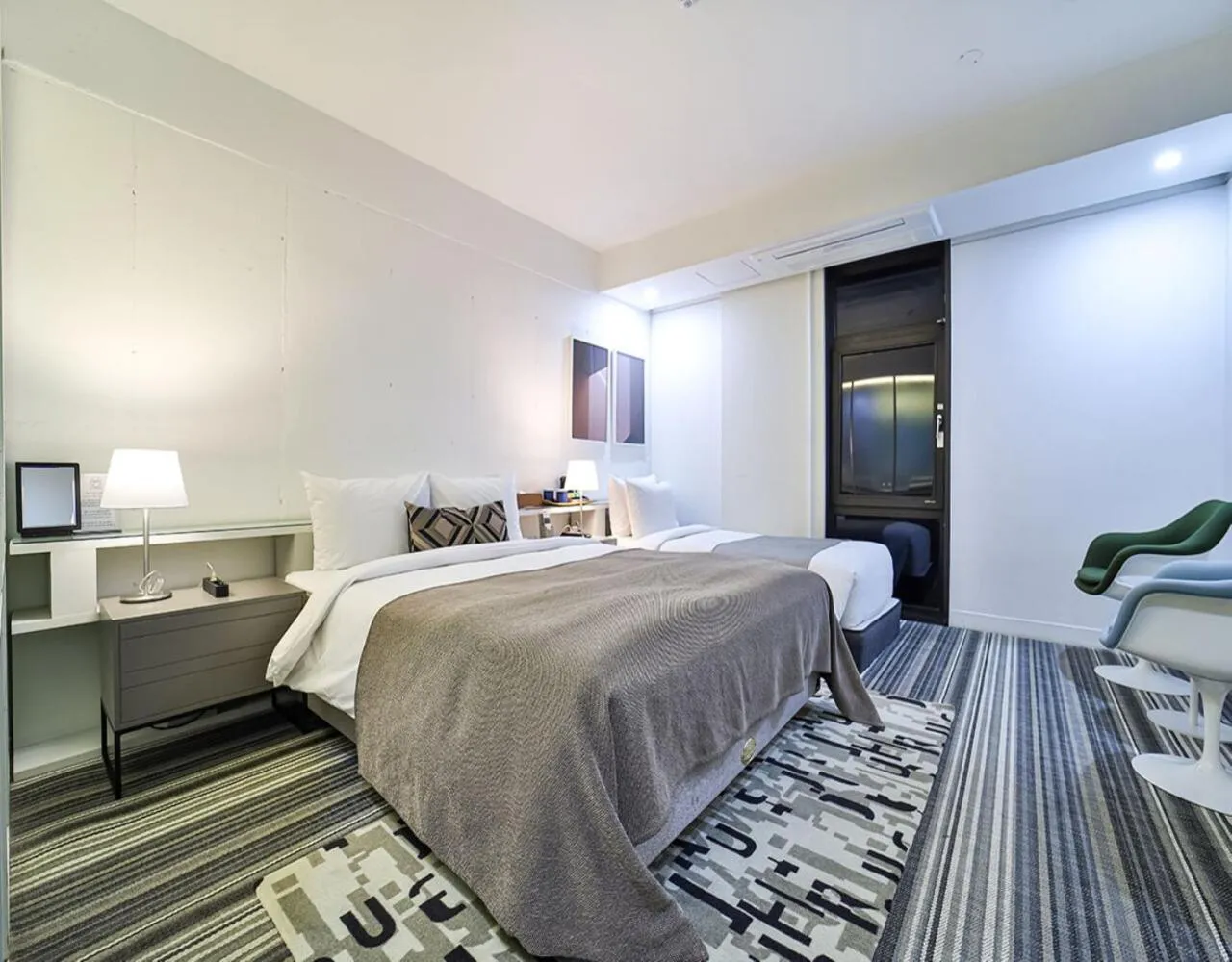 Bed in JS Boutique Hotel