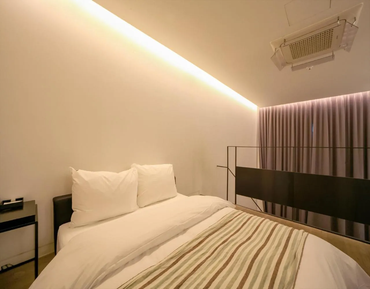 Bed in JS Boutique Hotel