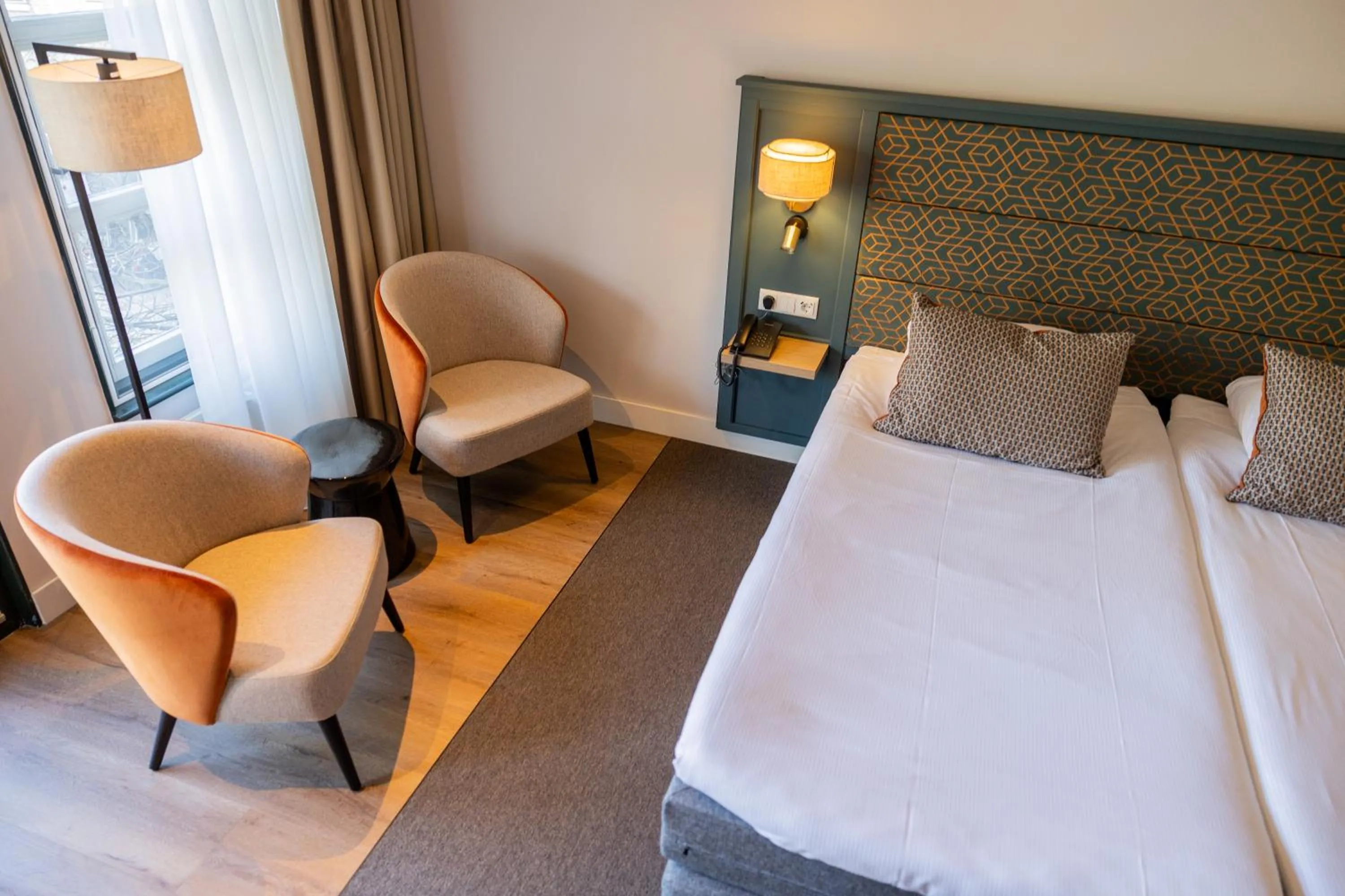 Seating area, Bed in Parkhotel Tjaarda