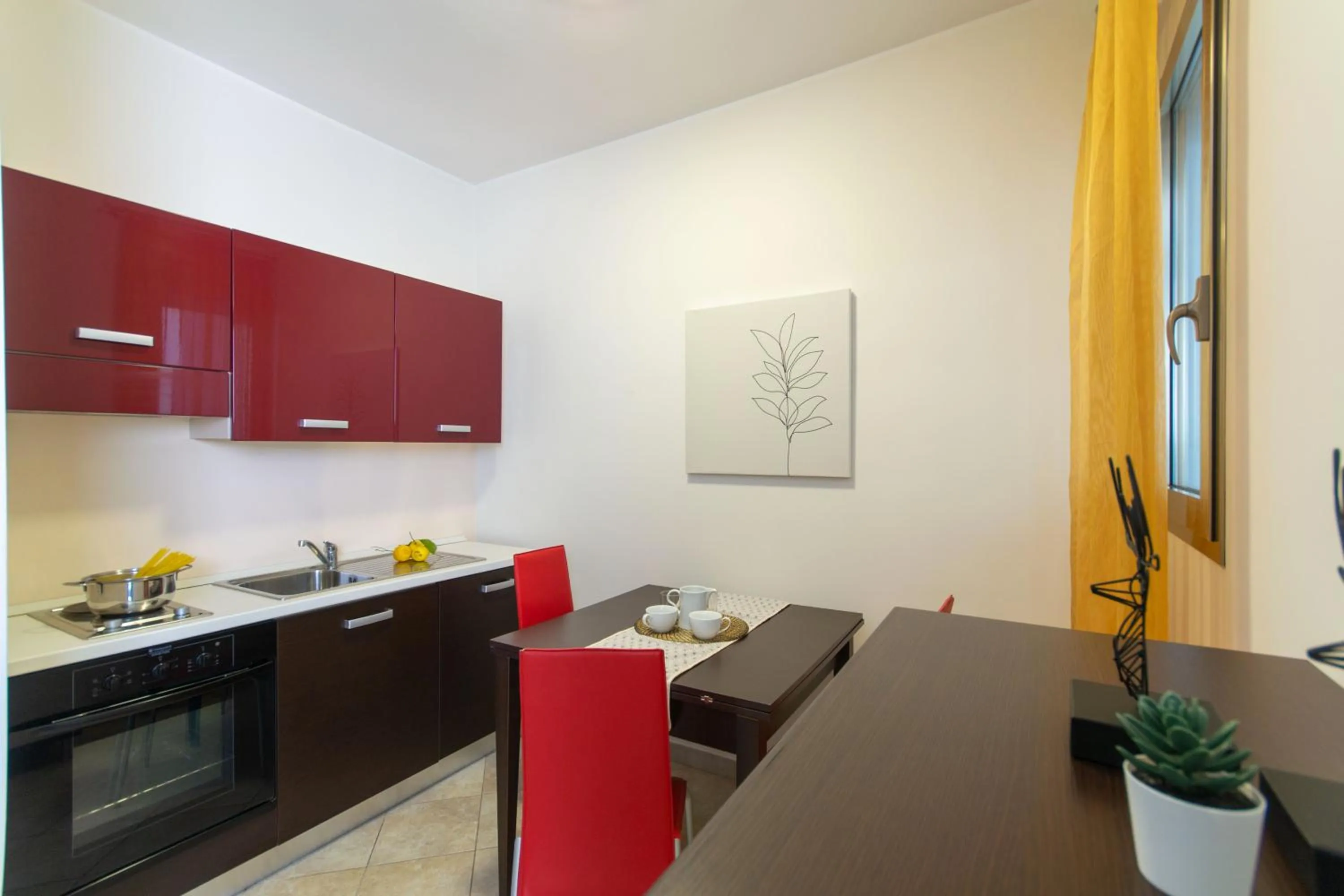 Kitchen or kitchenette in Residence Borgo & Mare - Localo