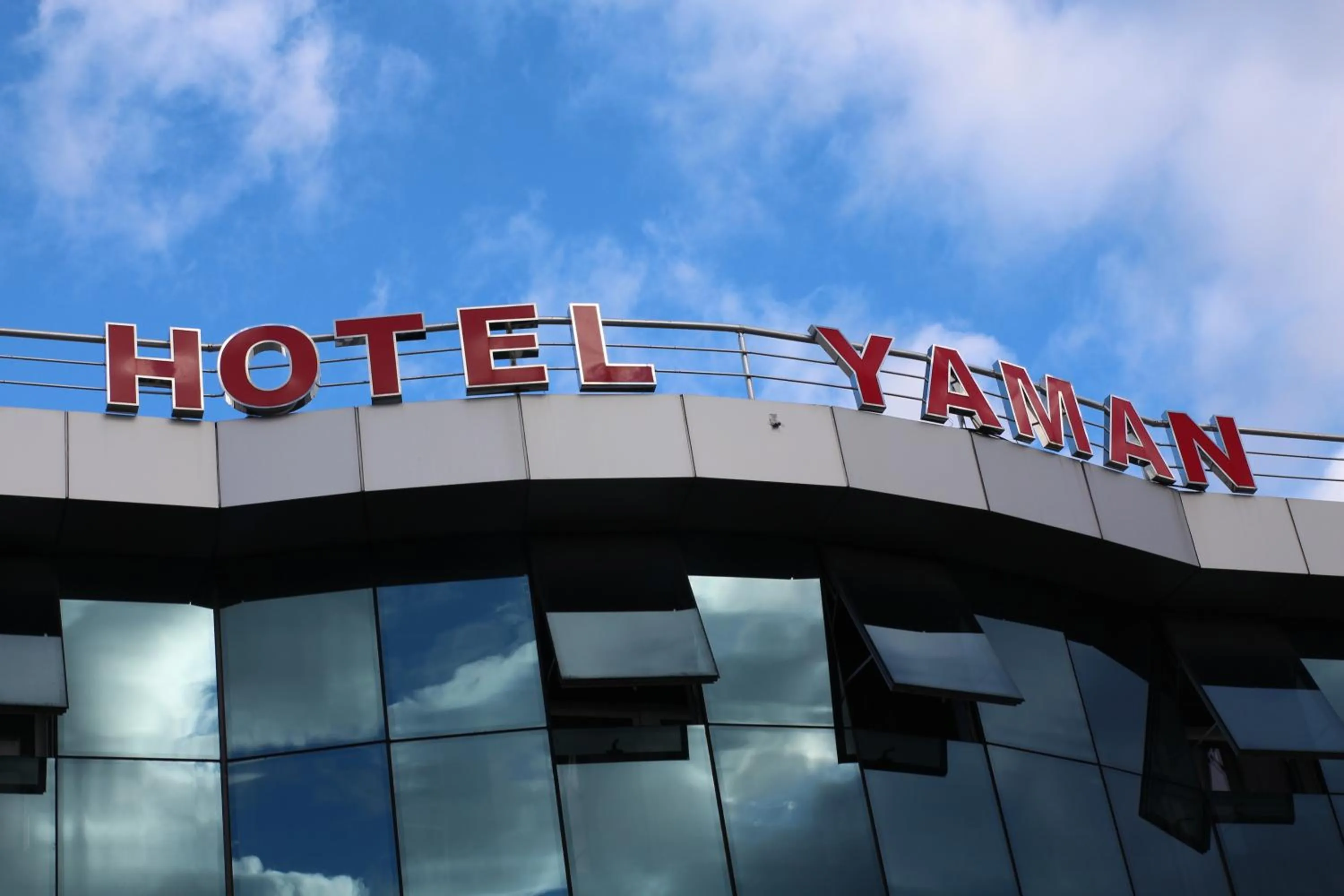 Property logo or sign in Hotel Yaman