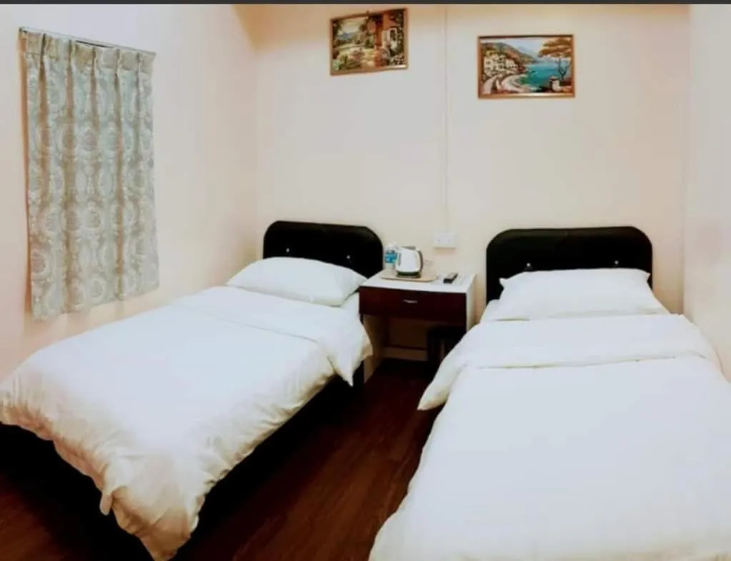 Bed in Sipadan Crystal Haven Inn