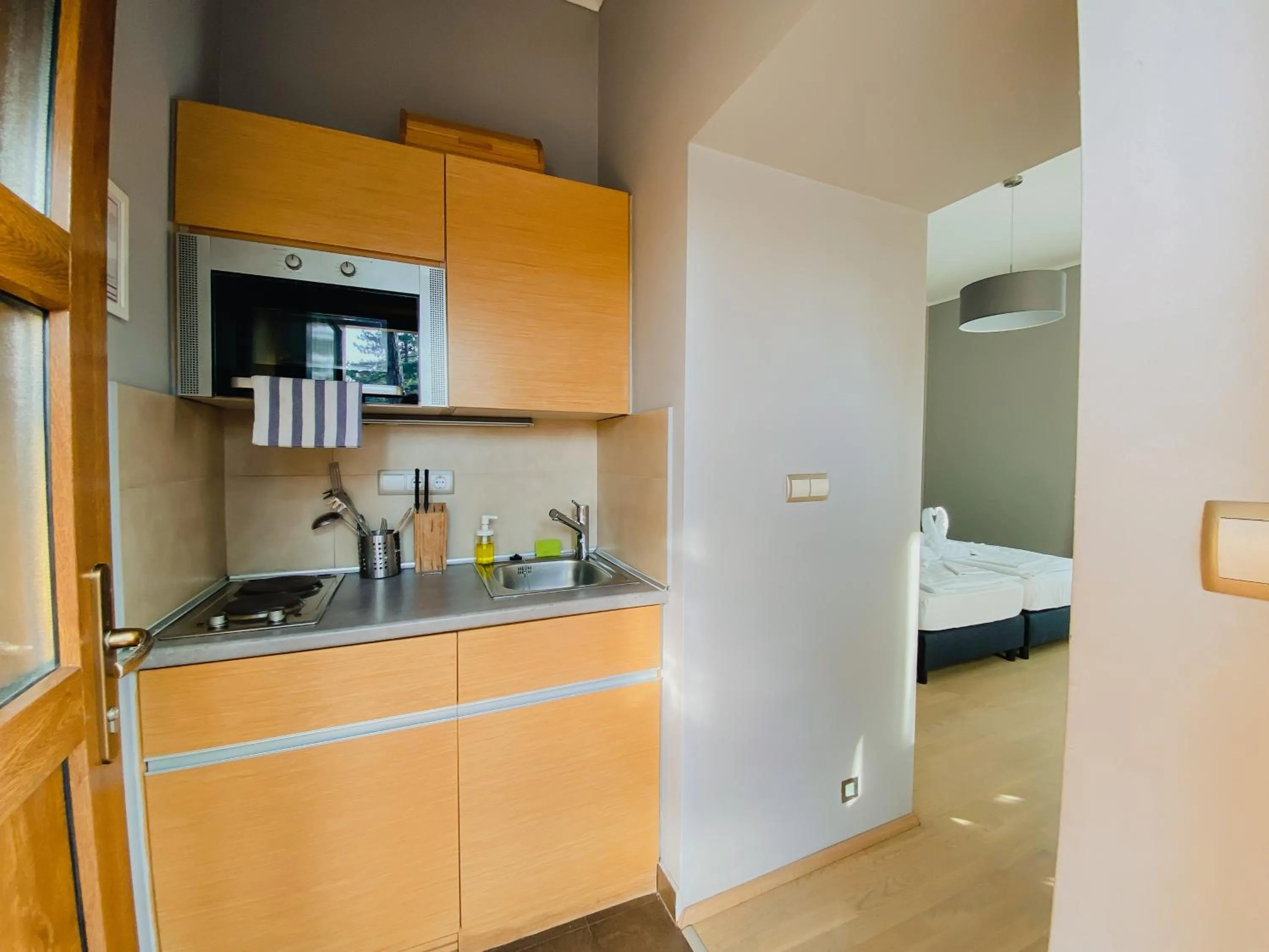 Kitchen or kitchenette, Bed in Royal Mediterran