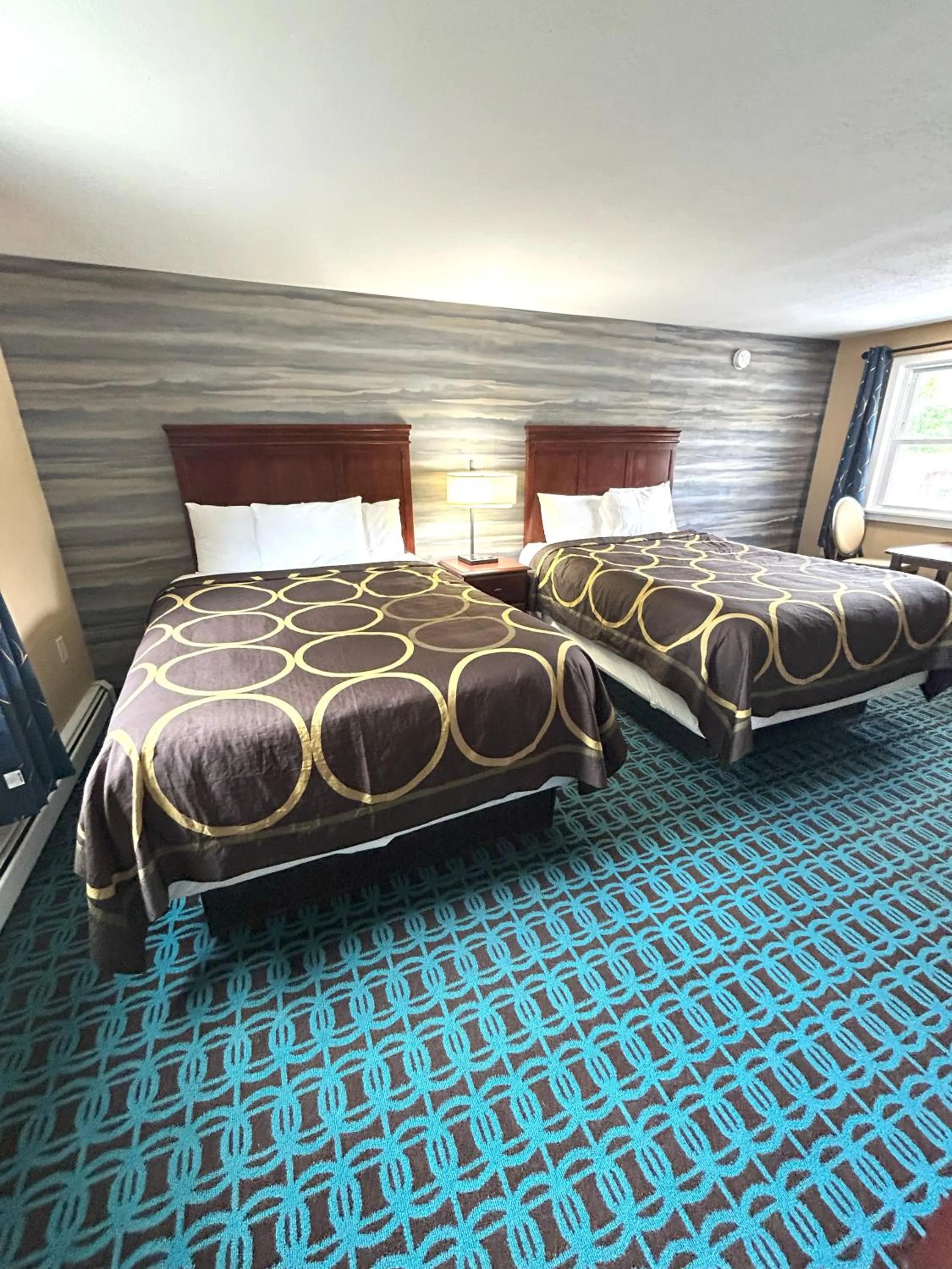 Bed in The Villager Motel