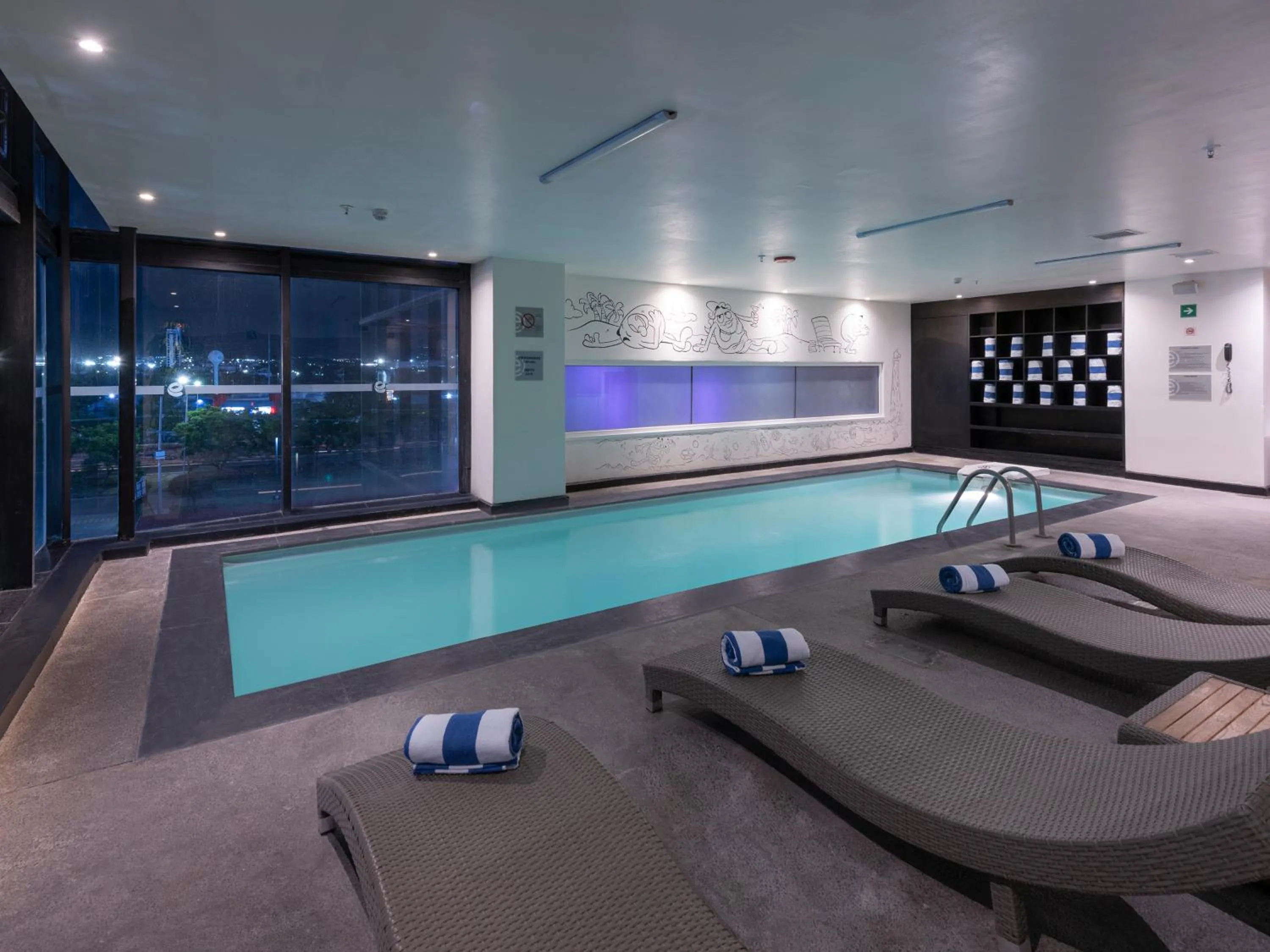 Swimming pool in Ramada Encore by Wyndham Queretaro