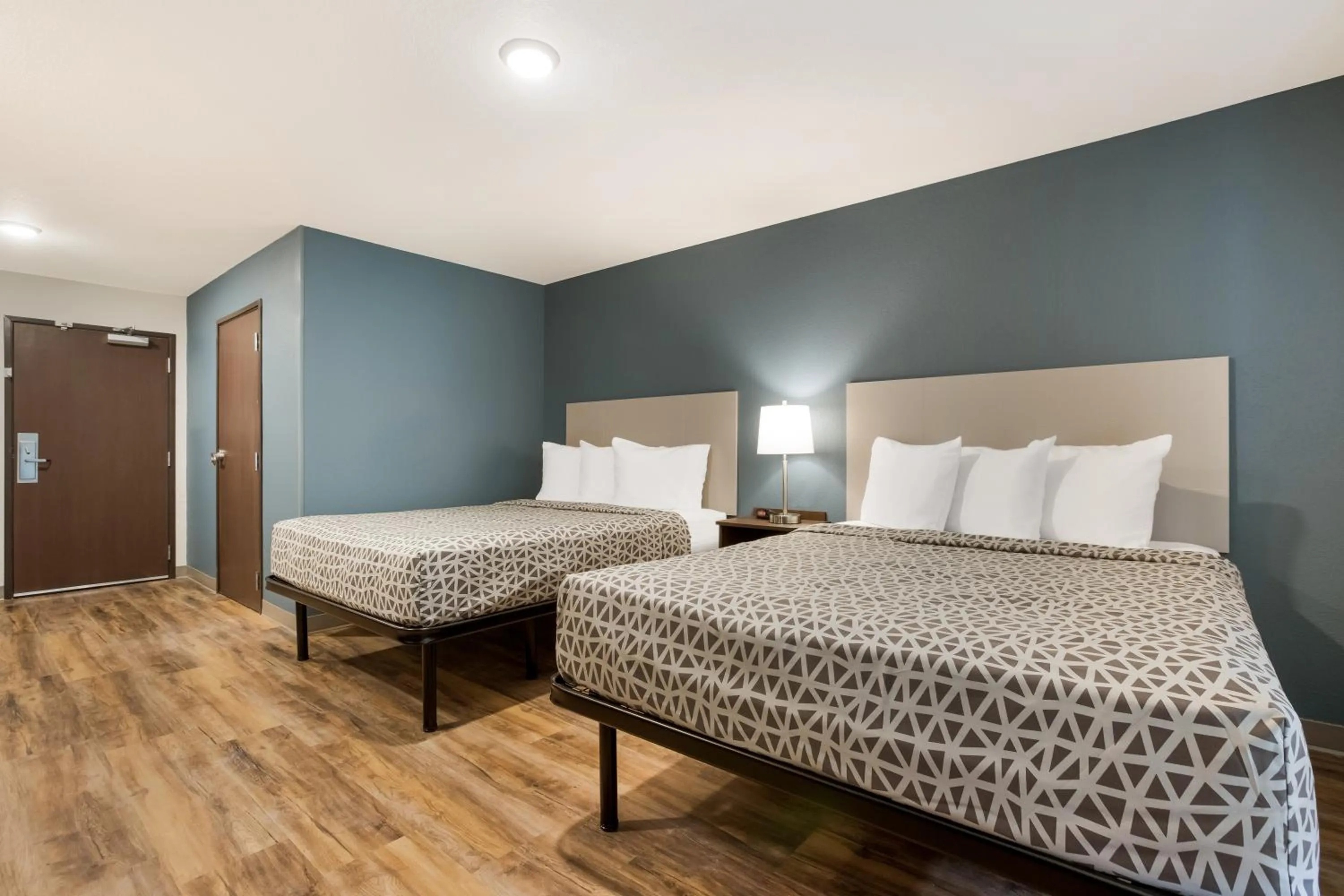 Bedroom, Bed in WoodSpring Suites Corona