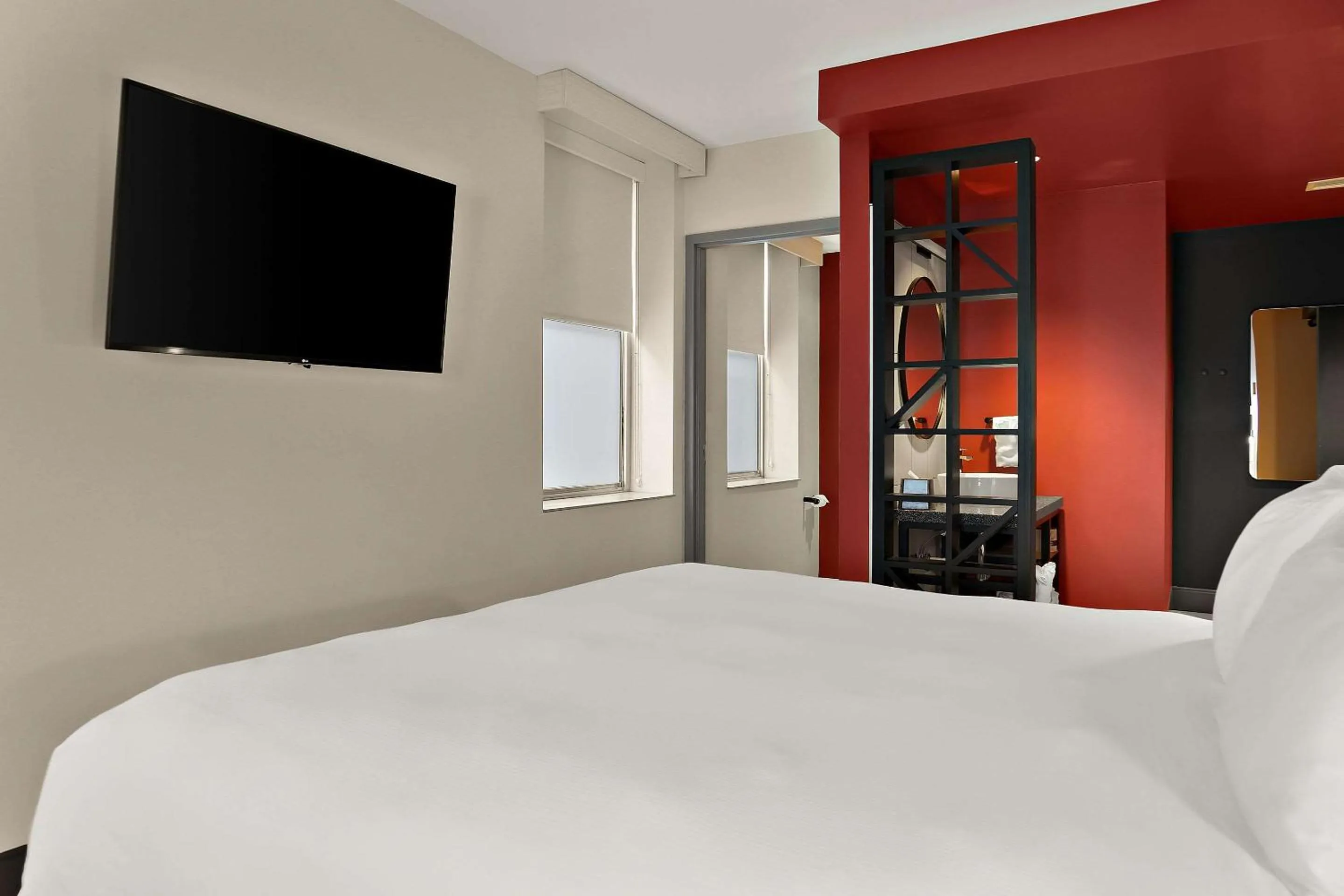 Bedroom in CityFlatsHotel - Port Huron, an Ascend Collection Hotel