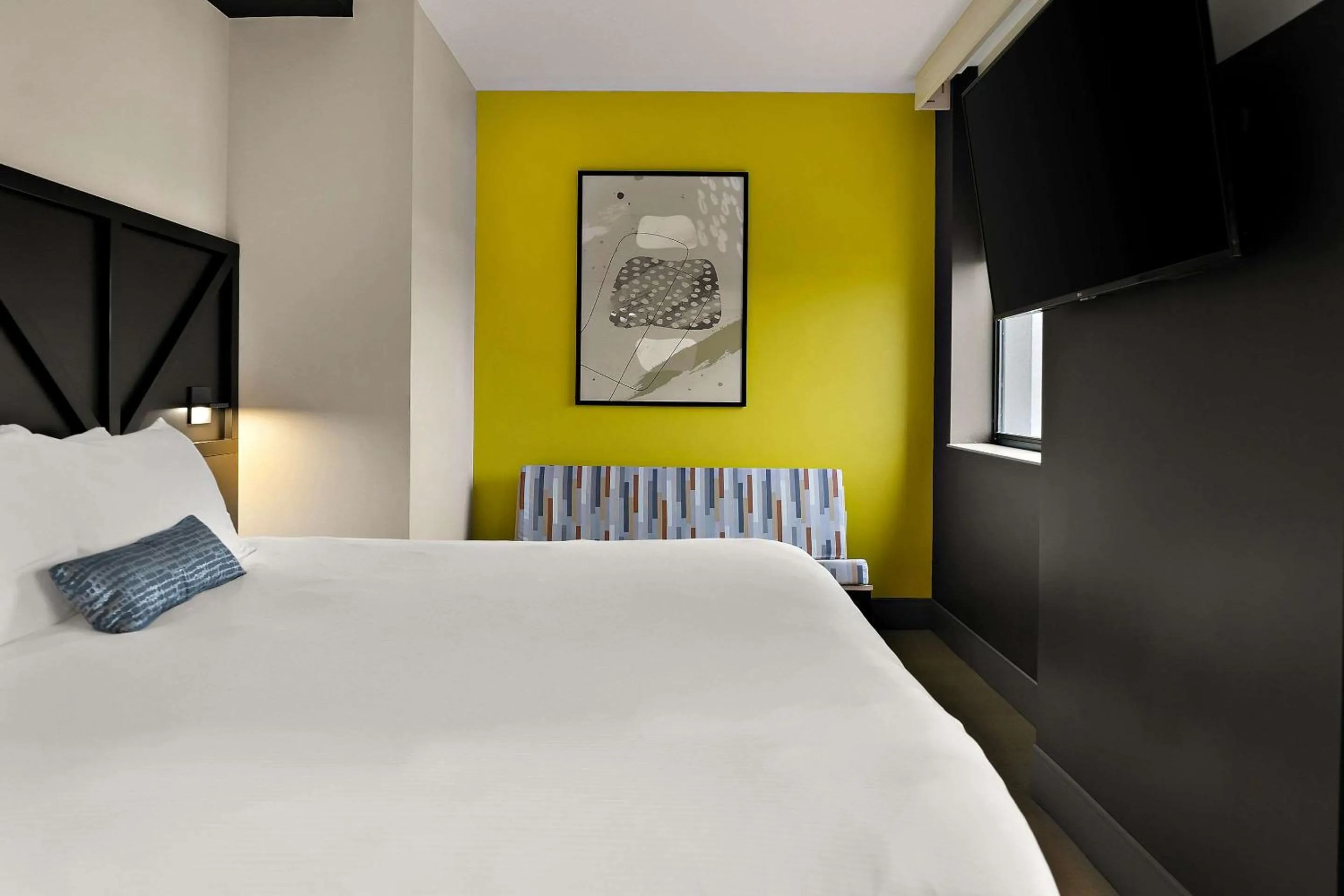 Bedroom in CityFlatsHotel - Port Huron, an Ascend Collection Hotel