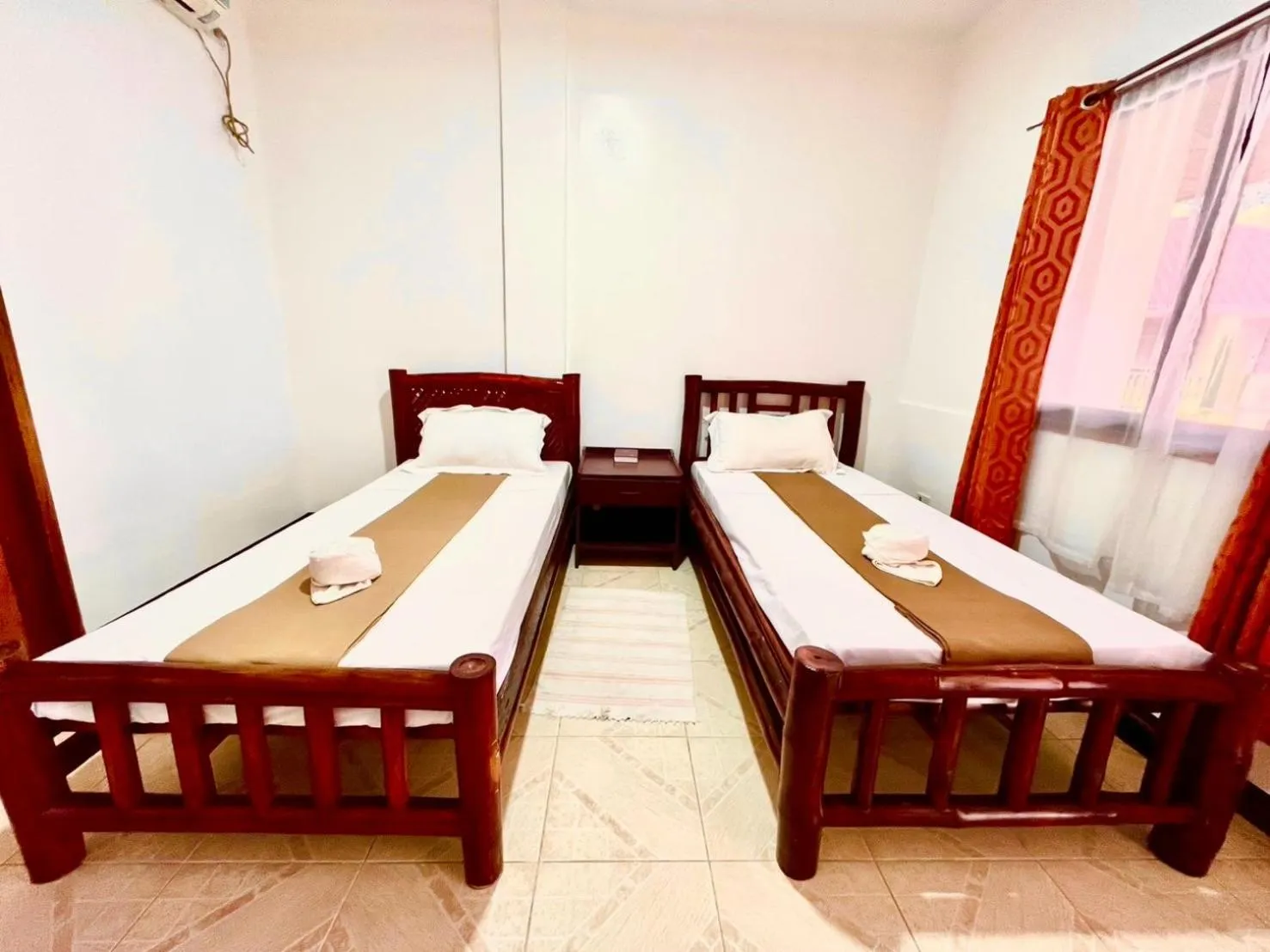 Bed in CHIISAI NATSU RESORT