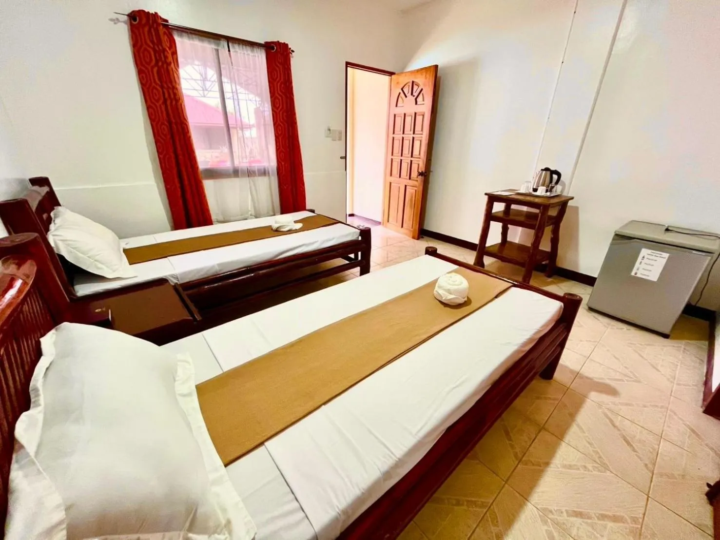 Bed in CHIISAI NATSU RESORT