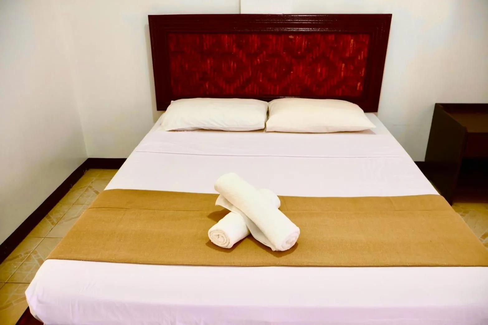 Bed in CHIISAI NATSU RESORT