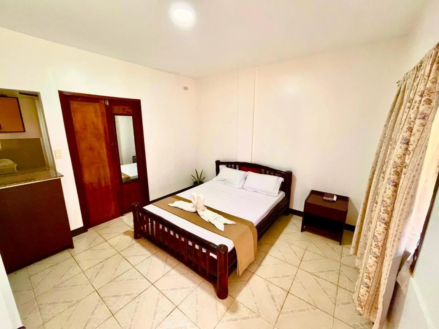 Bed in CHIISAI NATSU RESORT