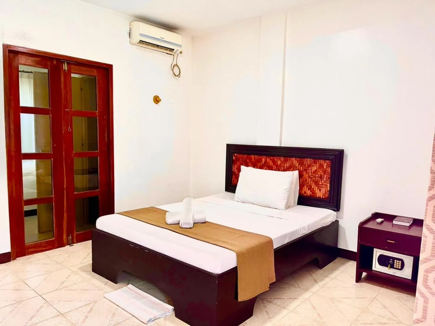 Bed in CHIISAI NATSU RESORT