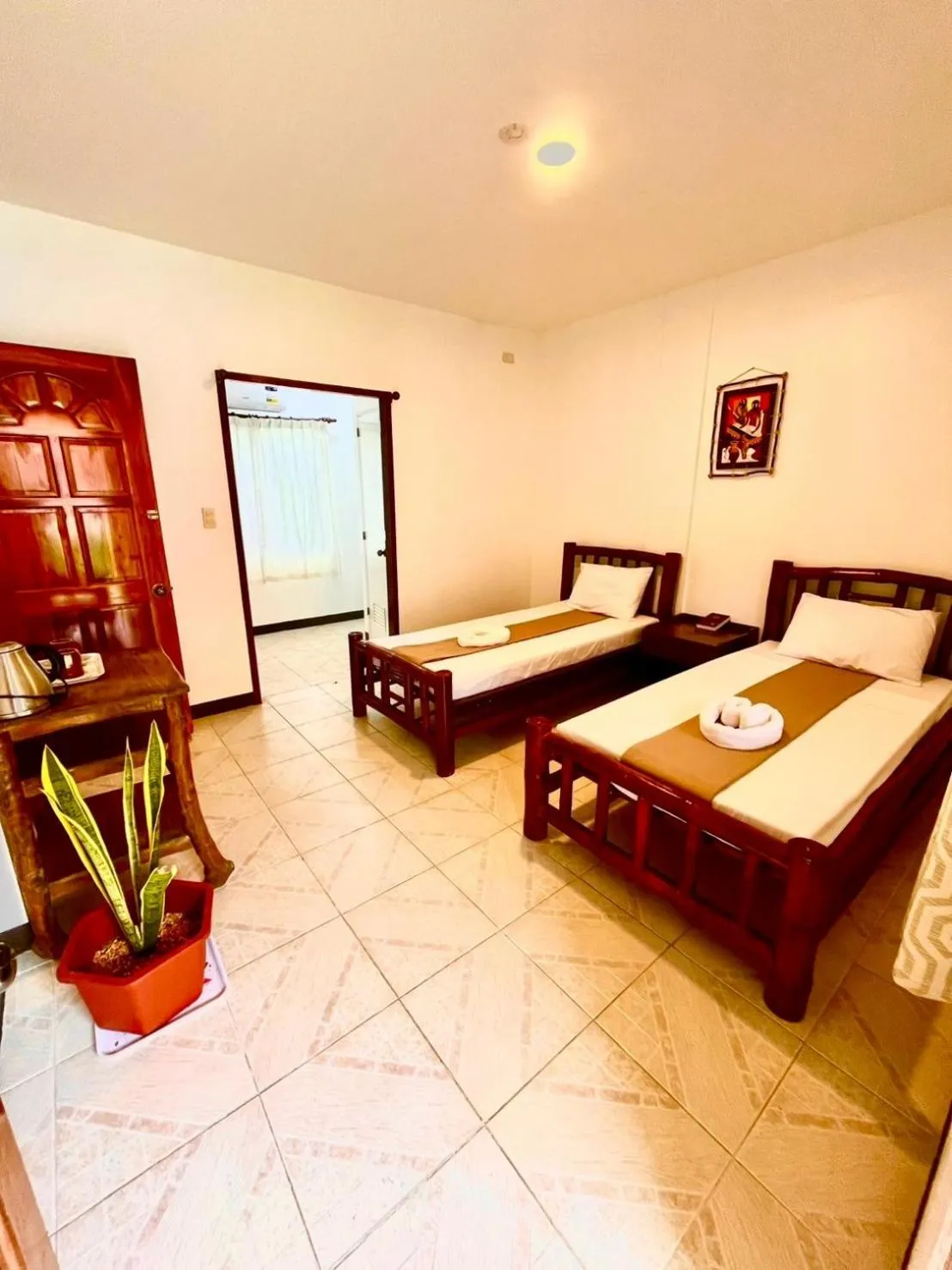 Bed in CHIISAI NATSU RESORT