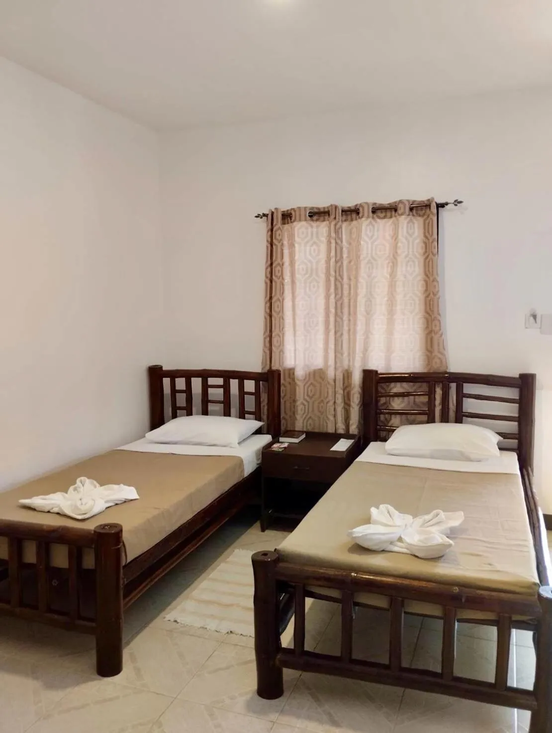 Bed in CHIISAI NATSU RESORT