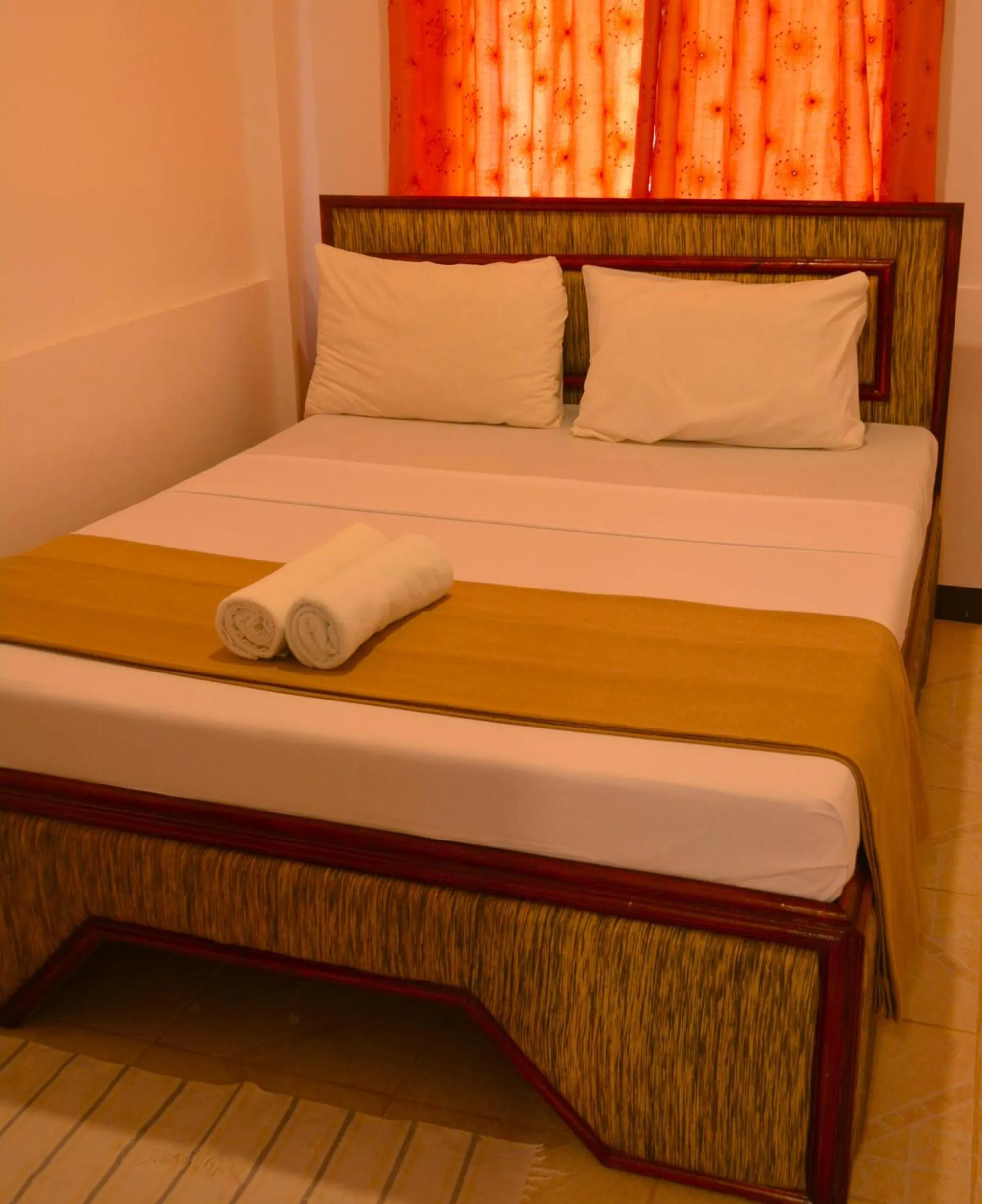 Bed in CHIISAI NATSU RESORT