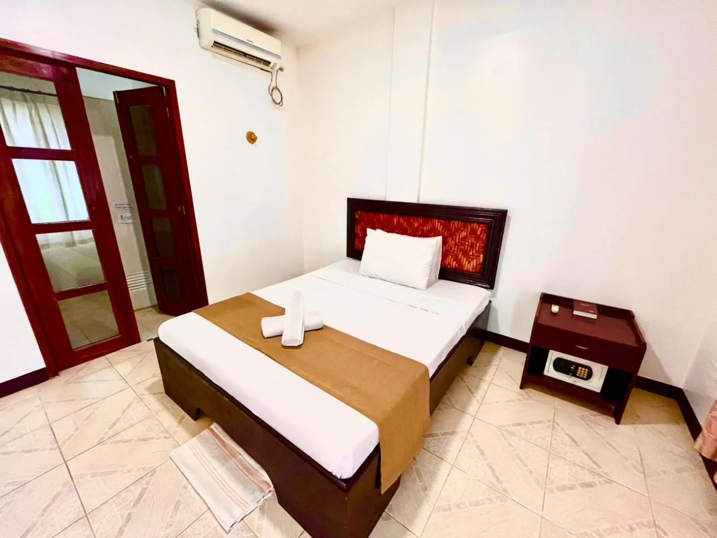 Bed in CHIISAI NATSU RESORT