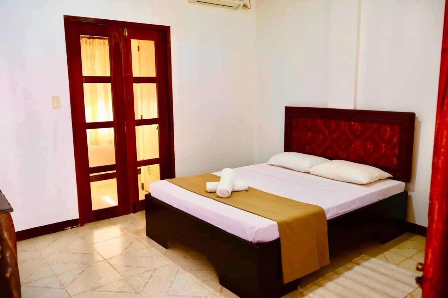 Bed in CHIISAI NATSU RESORT