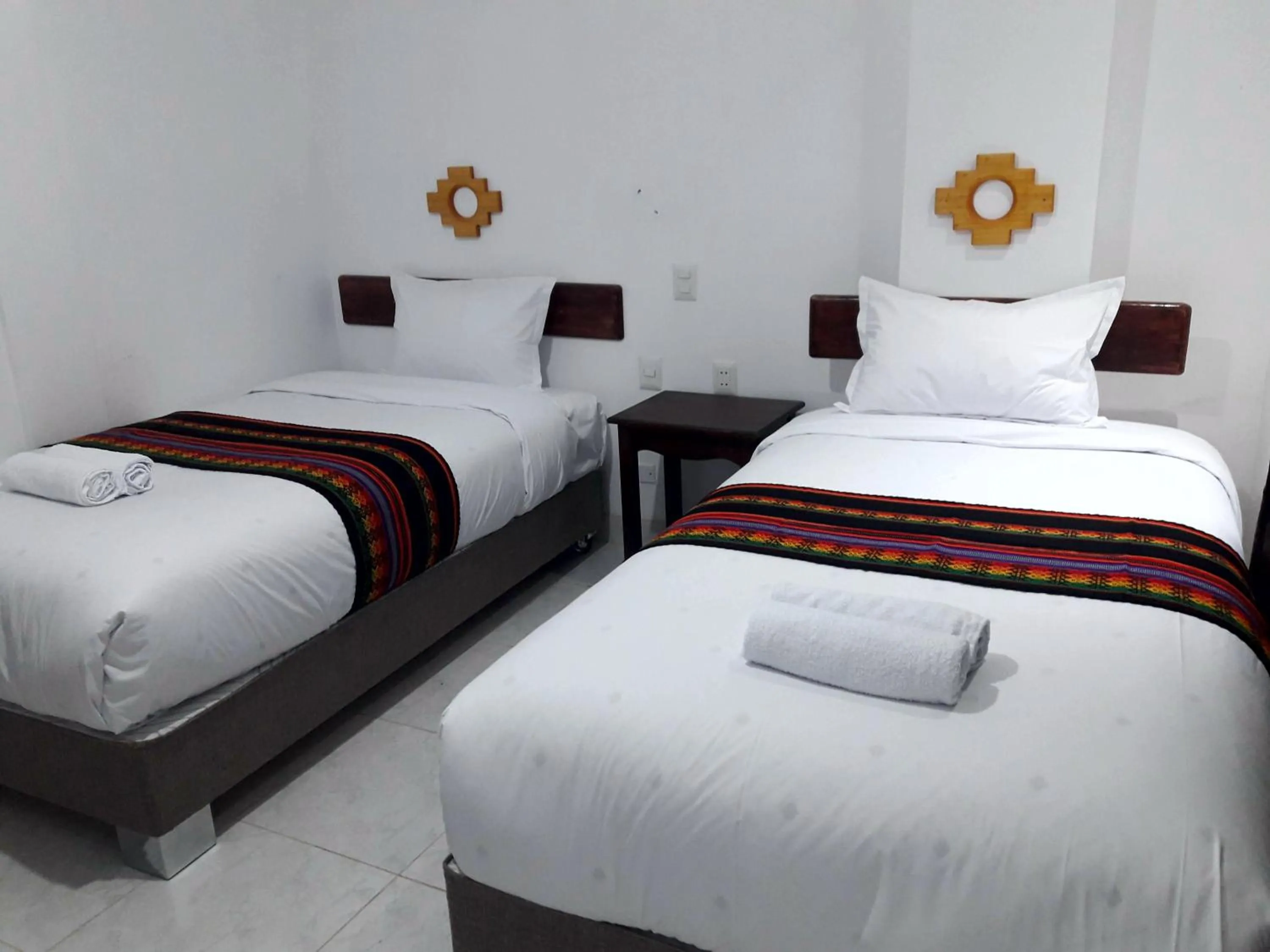 Bed in PAKARINA HOTEL