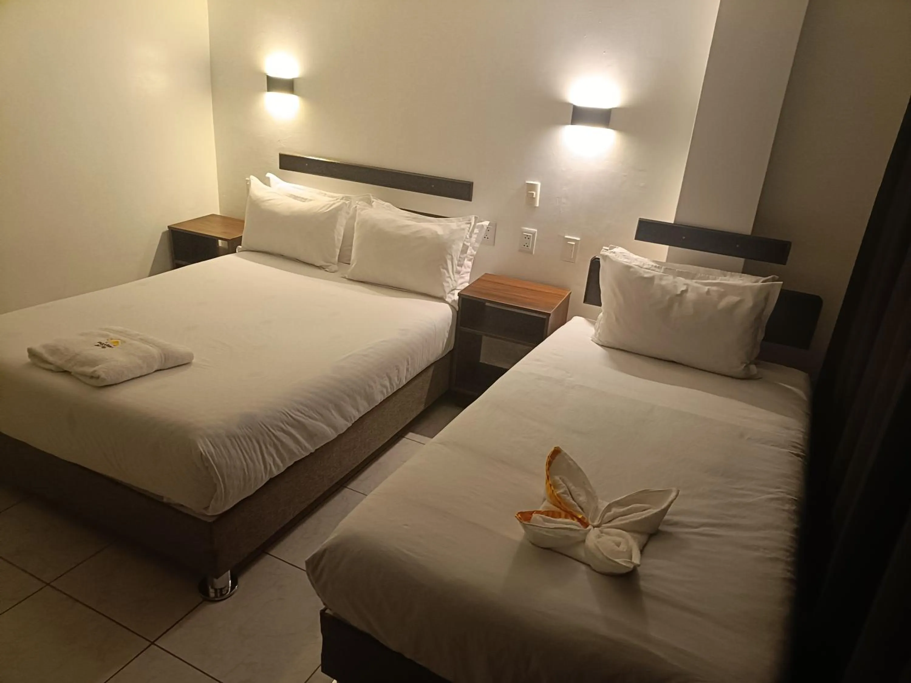 Bed in PAKARINA HOTEL