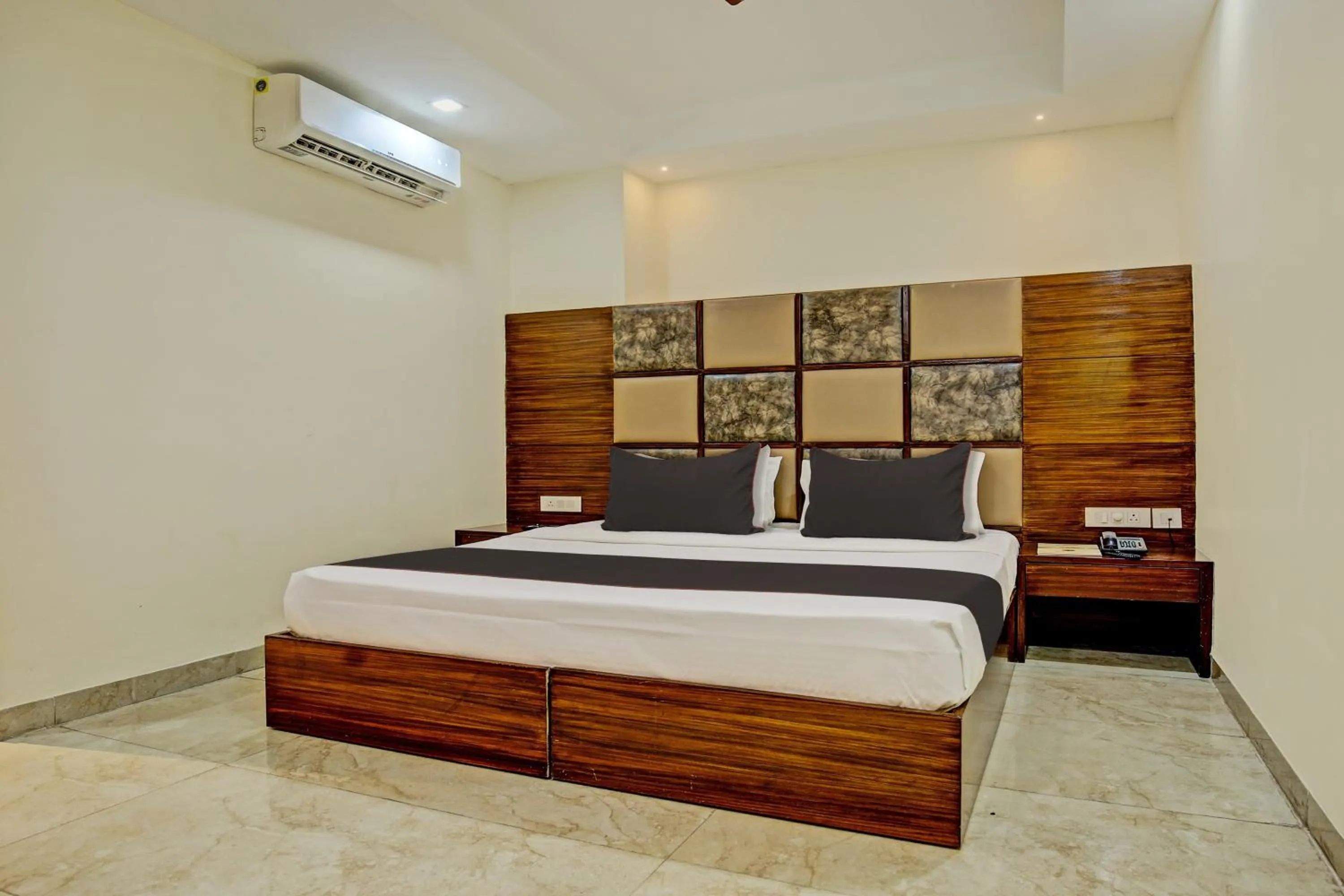 Bedroom, Bed in Super Townhouse Eastern View Formerly Vihaan Residency