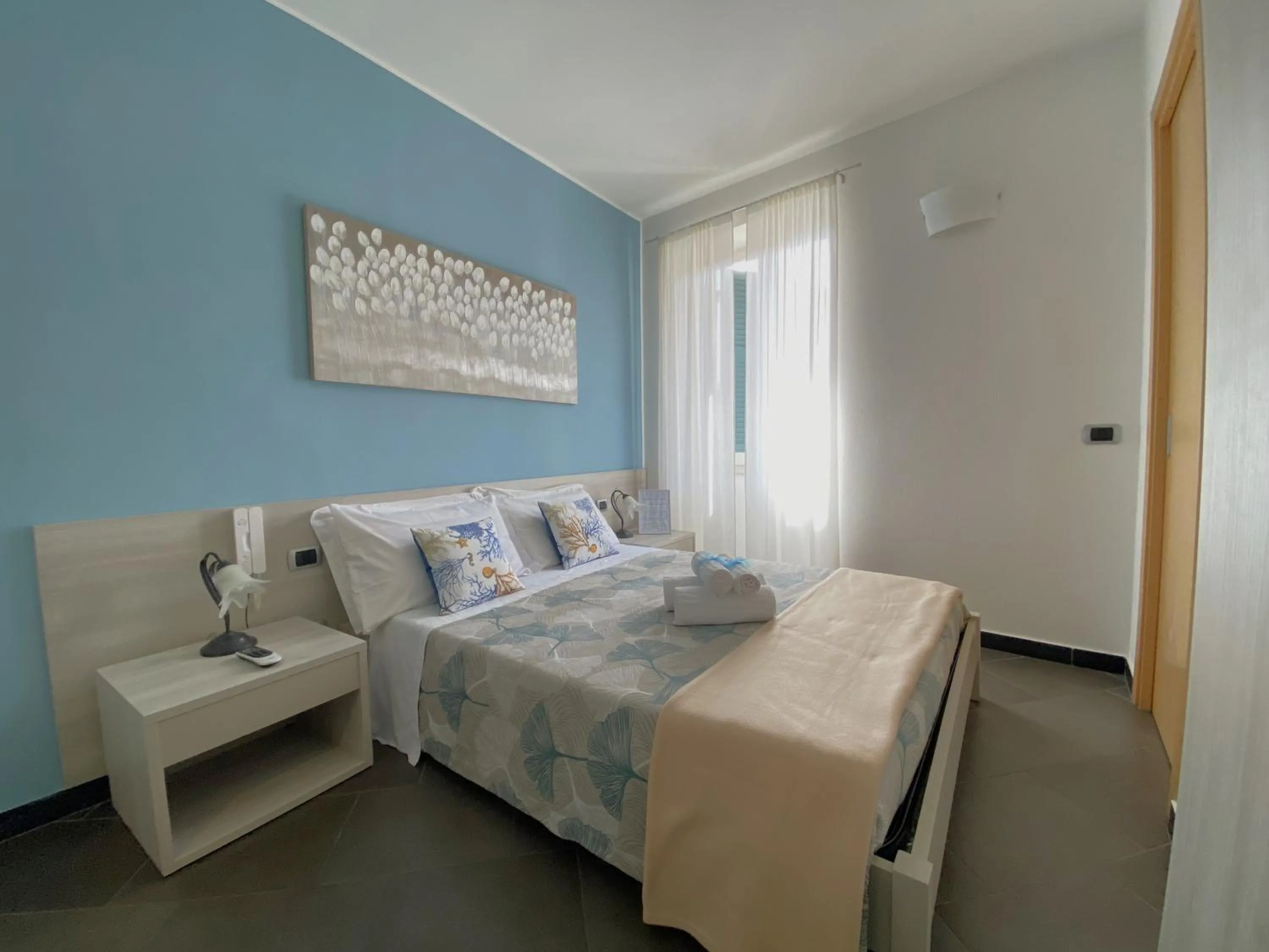 Photo of the whole room, Bed in Pensione Sorriso