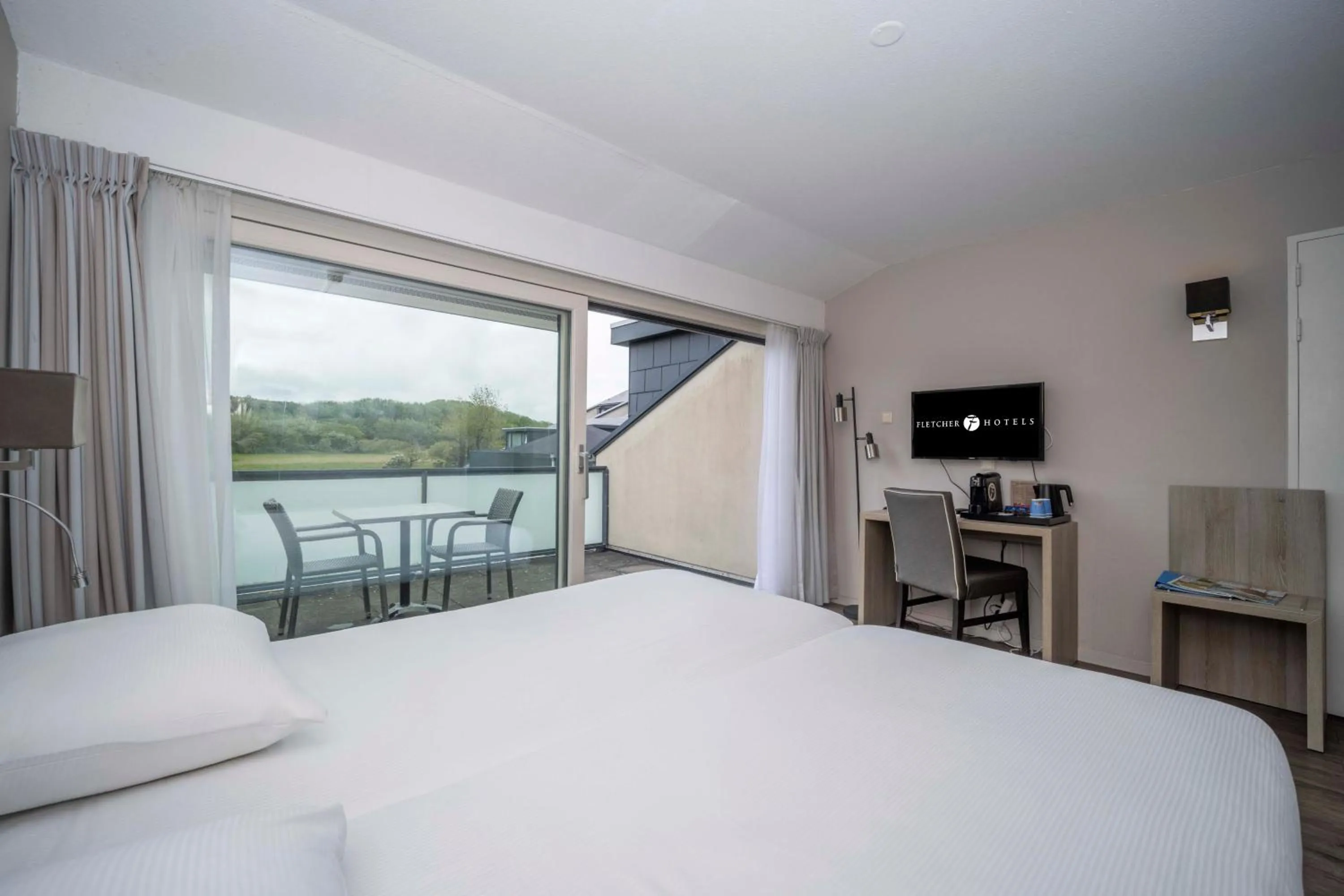 Photo of the whole room, Bed in Fletcher Zuiderduin Beachhotel