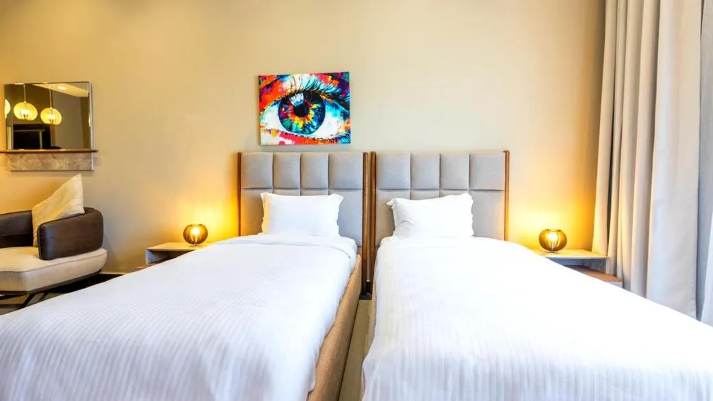 Bed in PLAYA DEL PACHA Suites Hotel