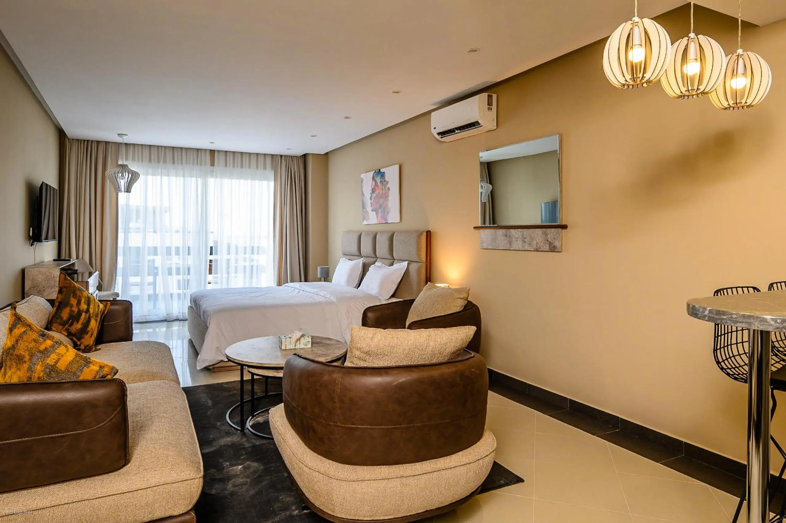 Living room, Bed in PLAYA DEL PACHA Suites Hotel