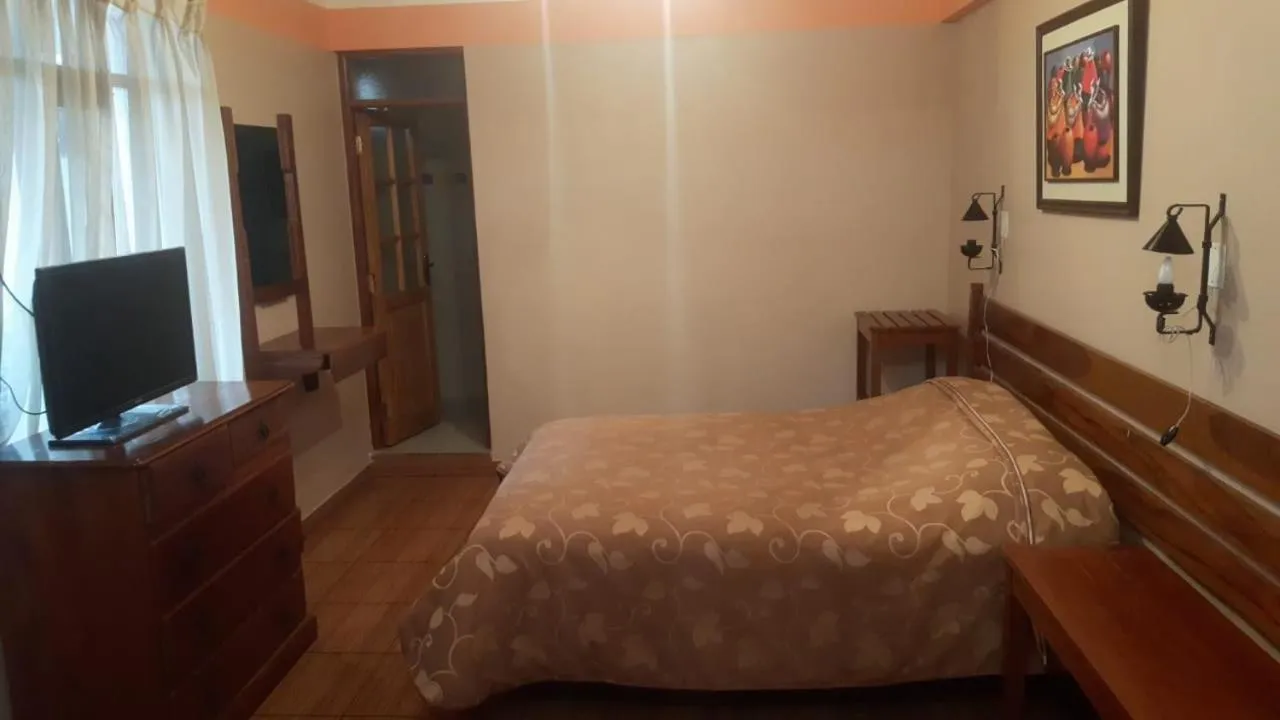 Communal lounge/ TV room, Bed in Cruz Popayan Sucre