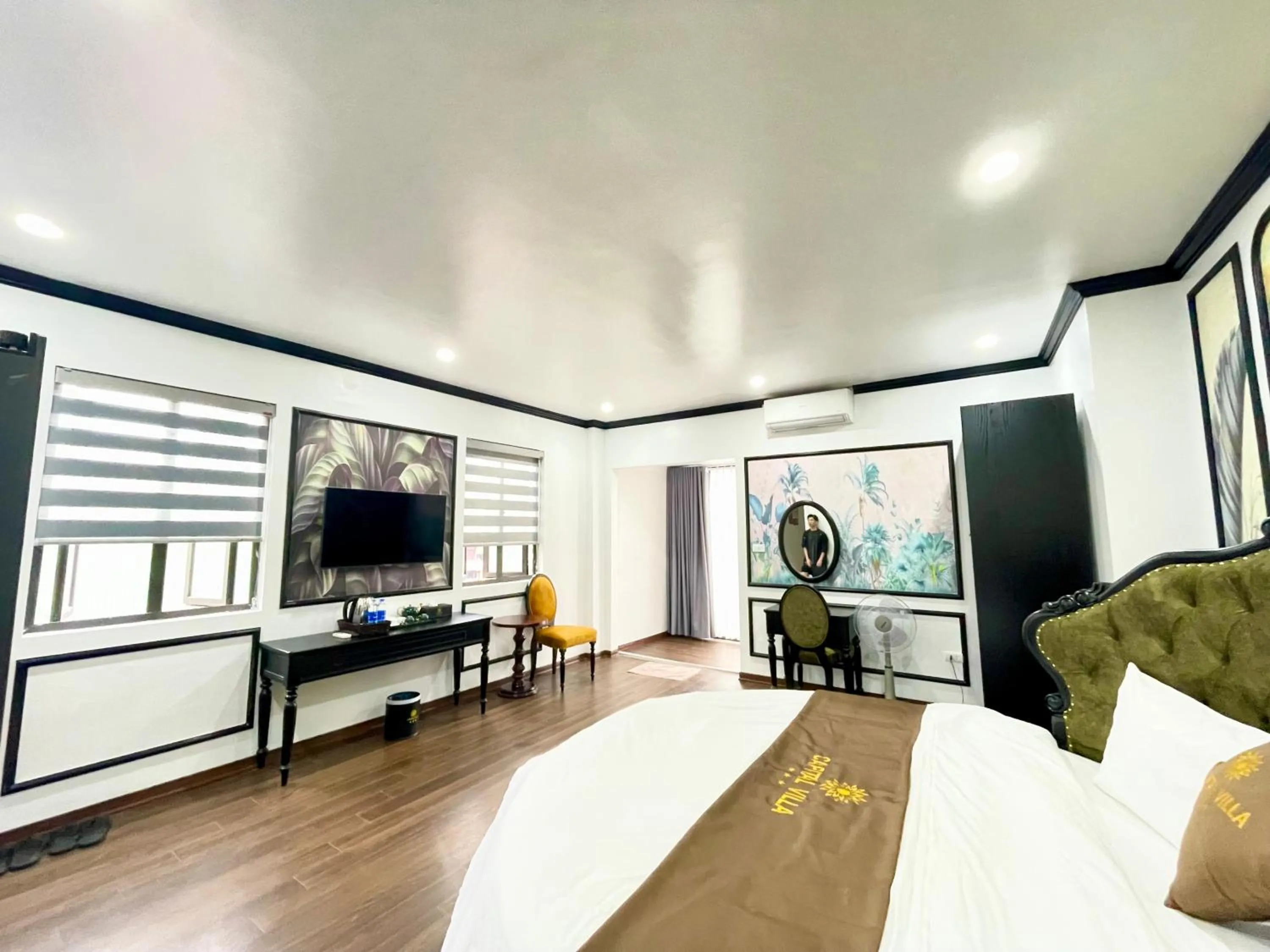 Communal lounge/ TV room, Bed in Capital CauGiay Hotel