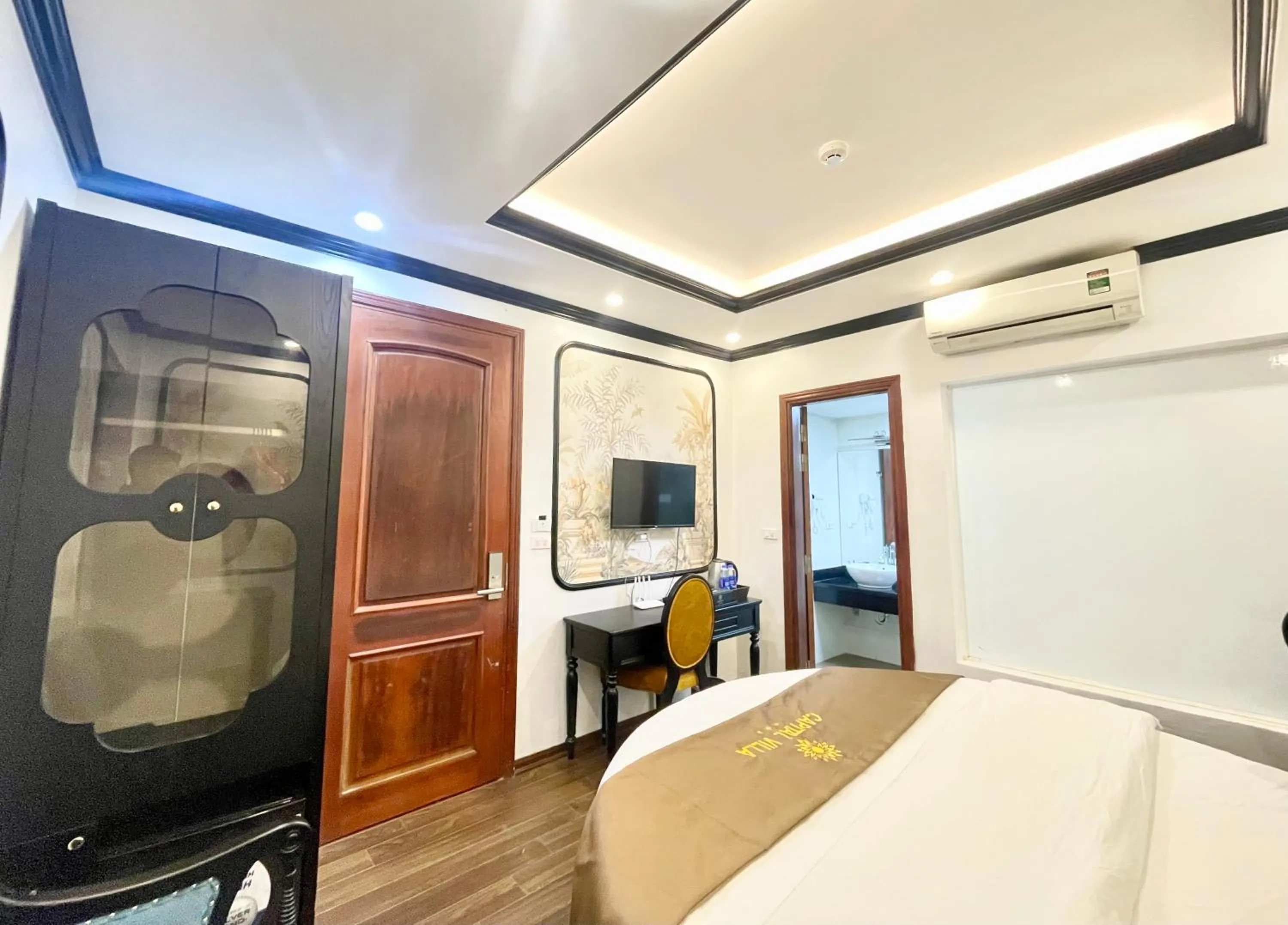 TV and multimedia, Bed in Capital CauGiay Hotel