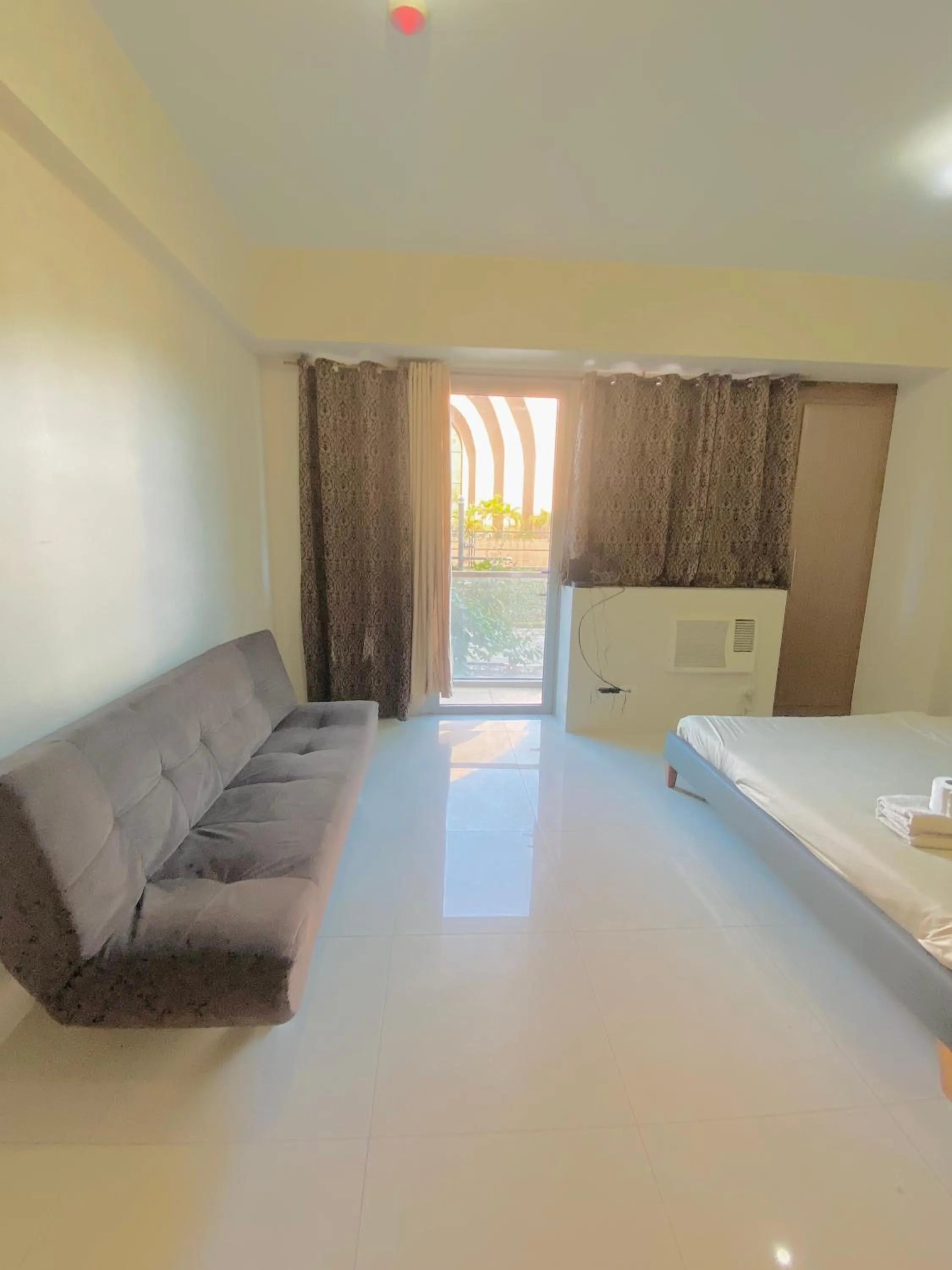 Bedroom in Kiel 5-Star Condo Hotel Across NAIA Manila Airport Terminal 3