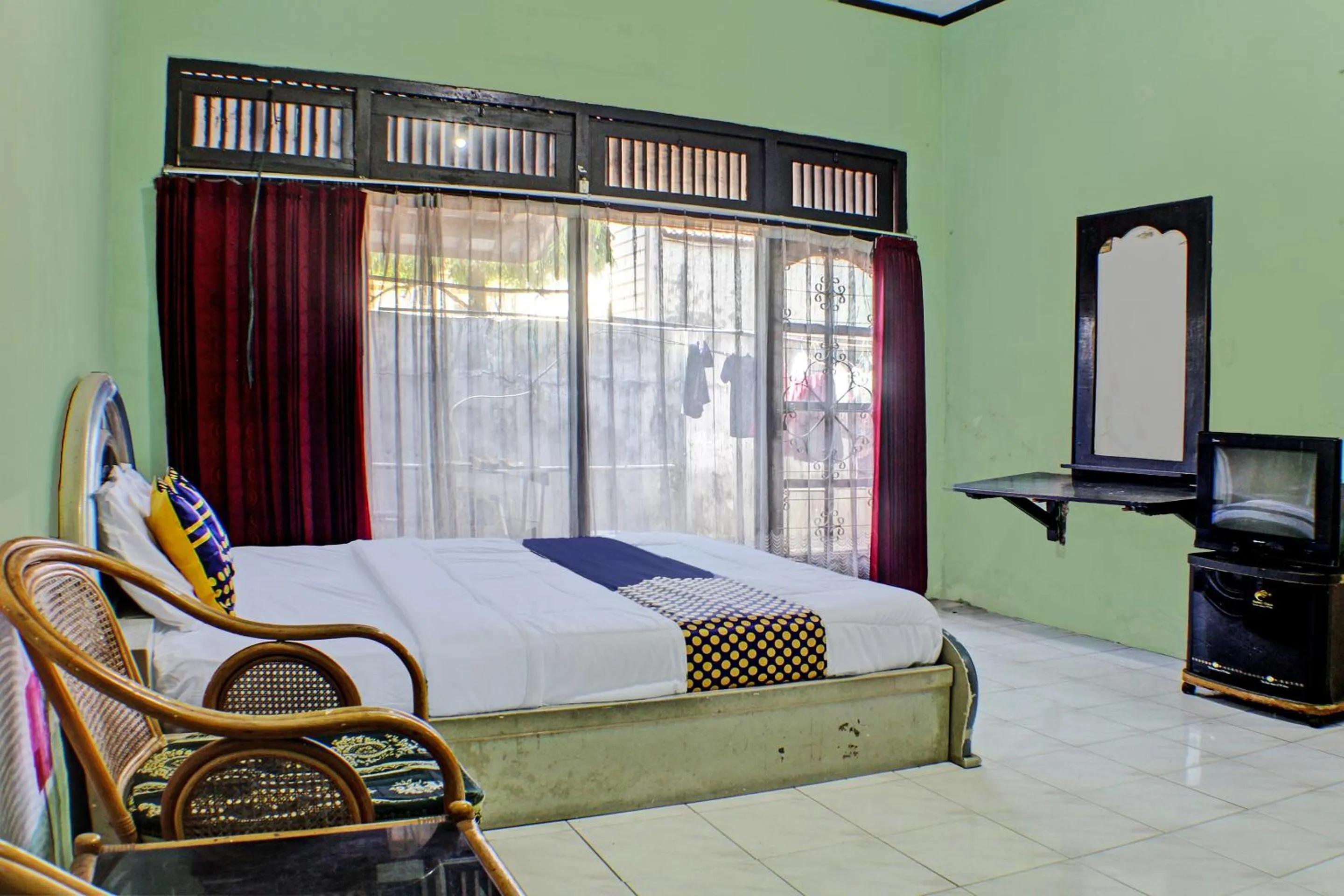 Bedroom in Hotel O Badar Guest House Syariah