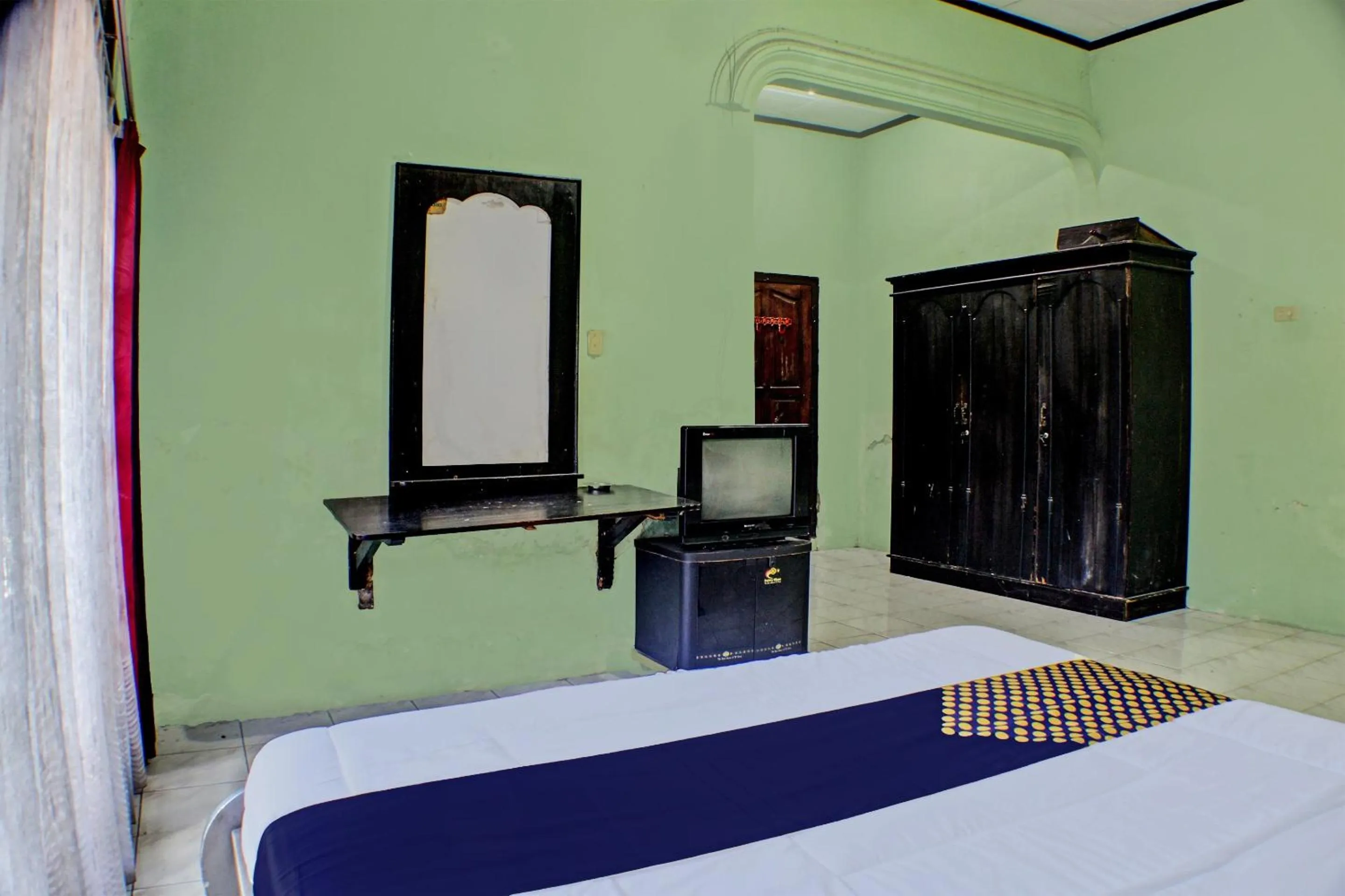 Bedroom in Hotel O Badar Guest House Syariah