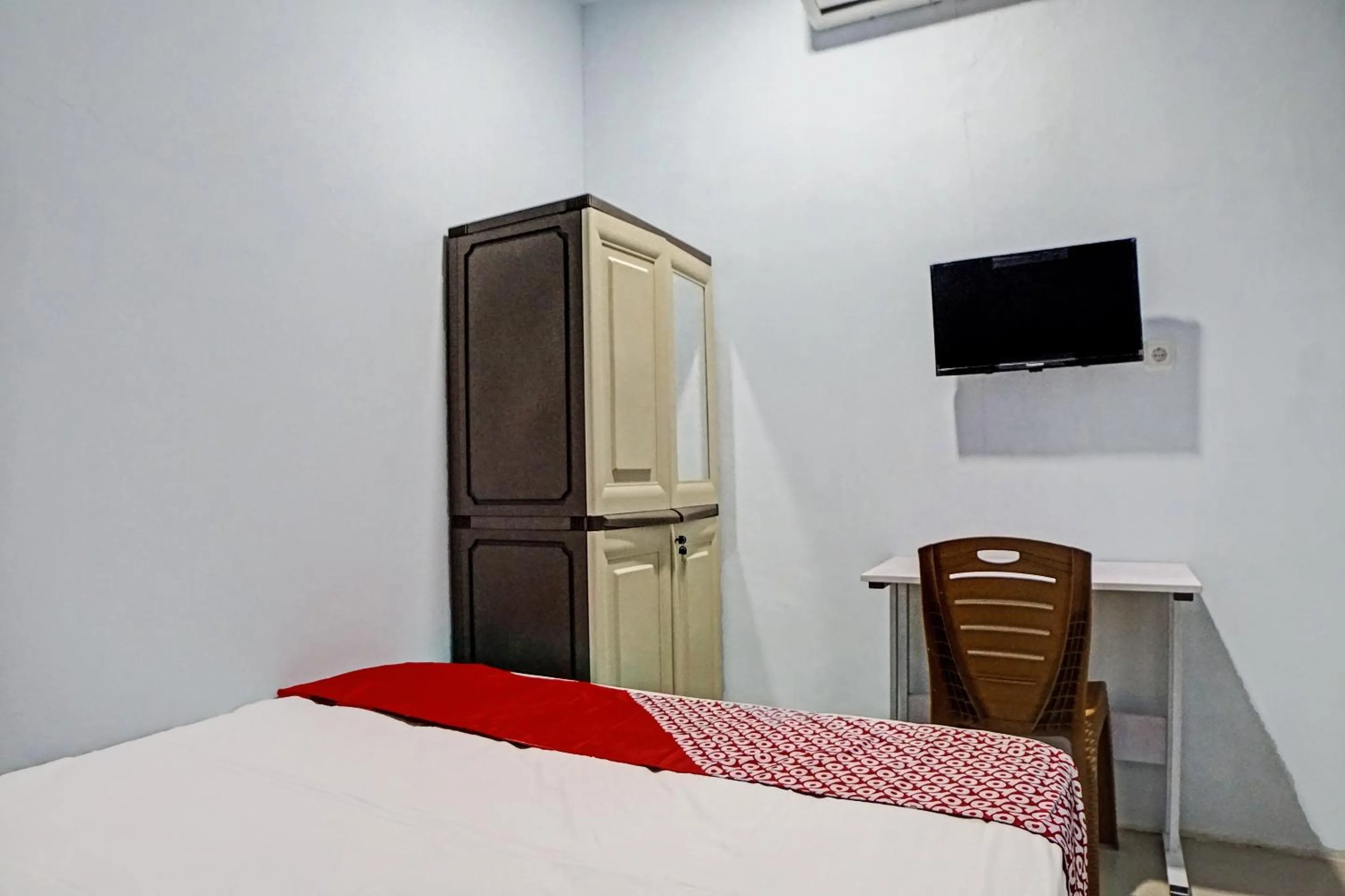 Bedroom in Hotel O Planet Guest House Syariah