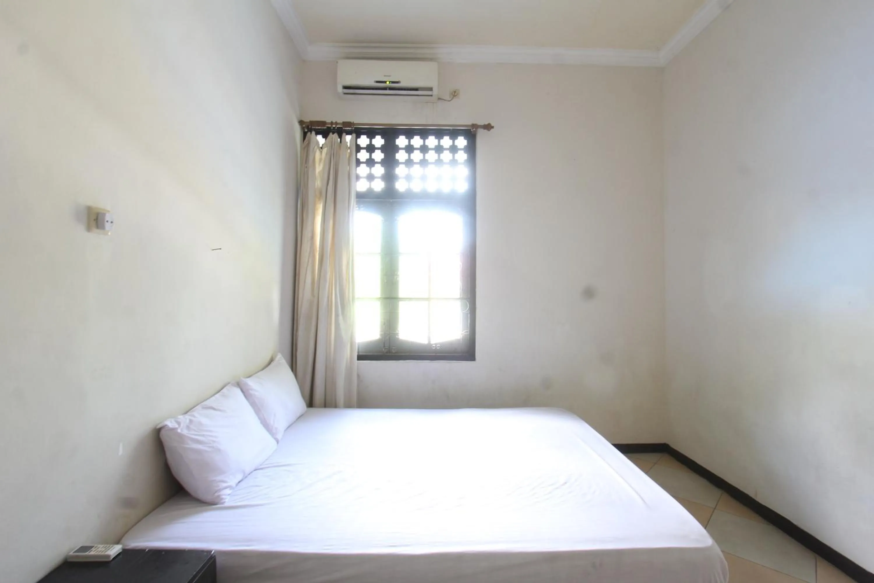 Bedroom in Hotel O Motel Langko