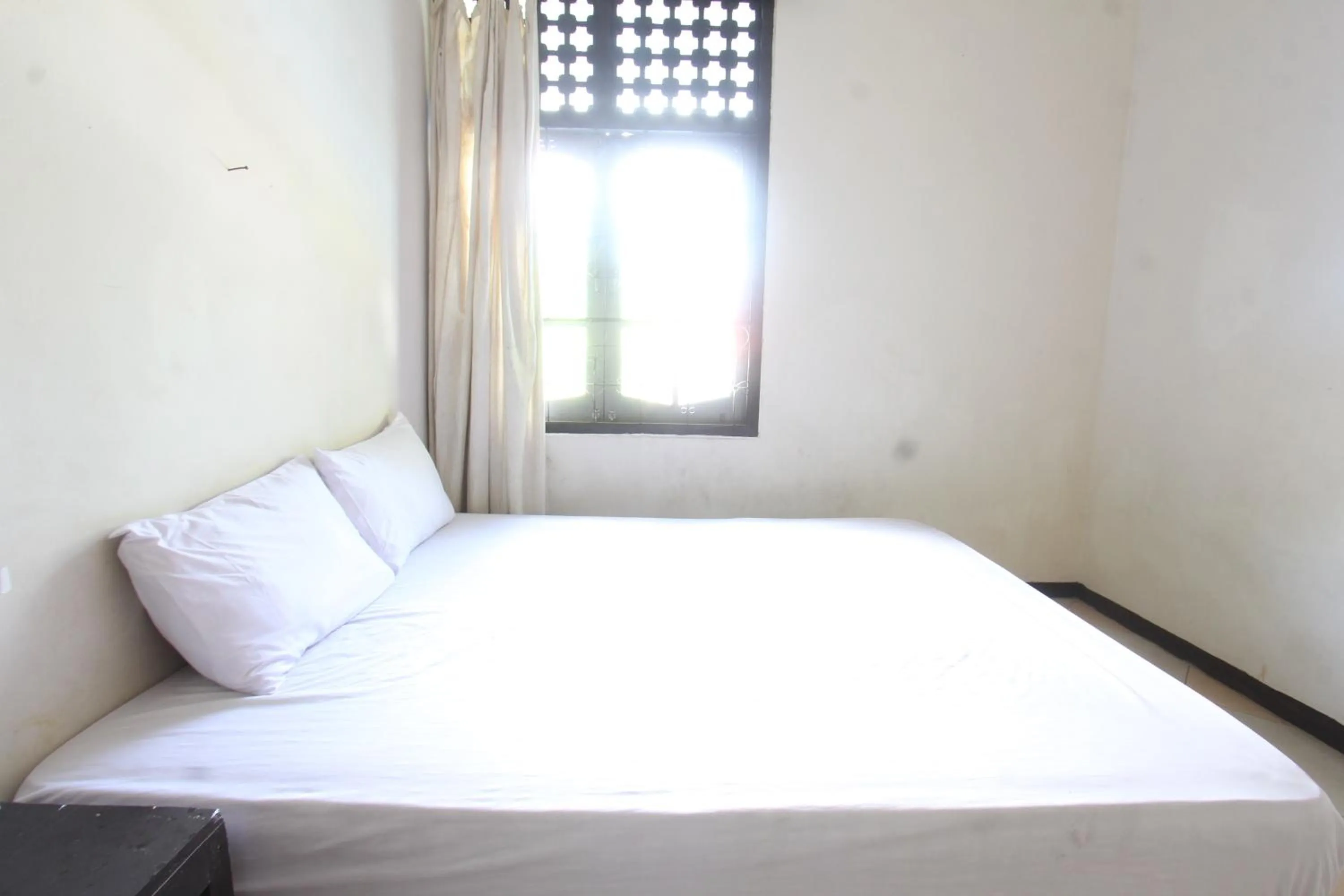 Bedroom in Hotel O Motel Langko