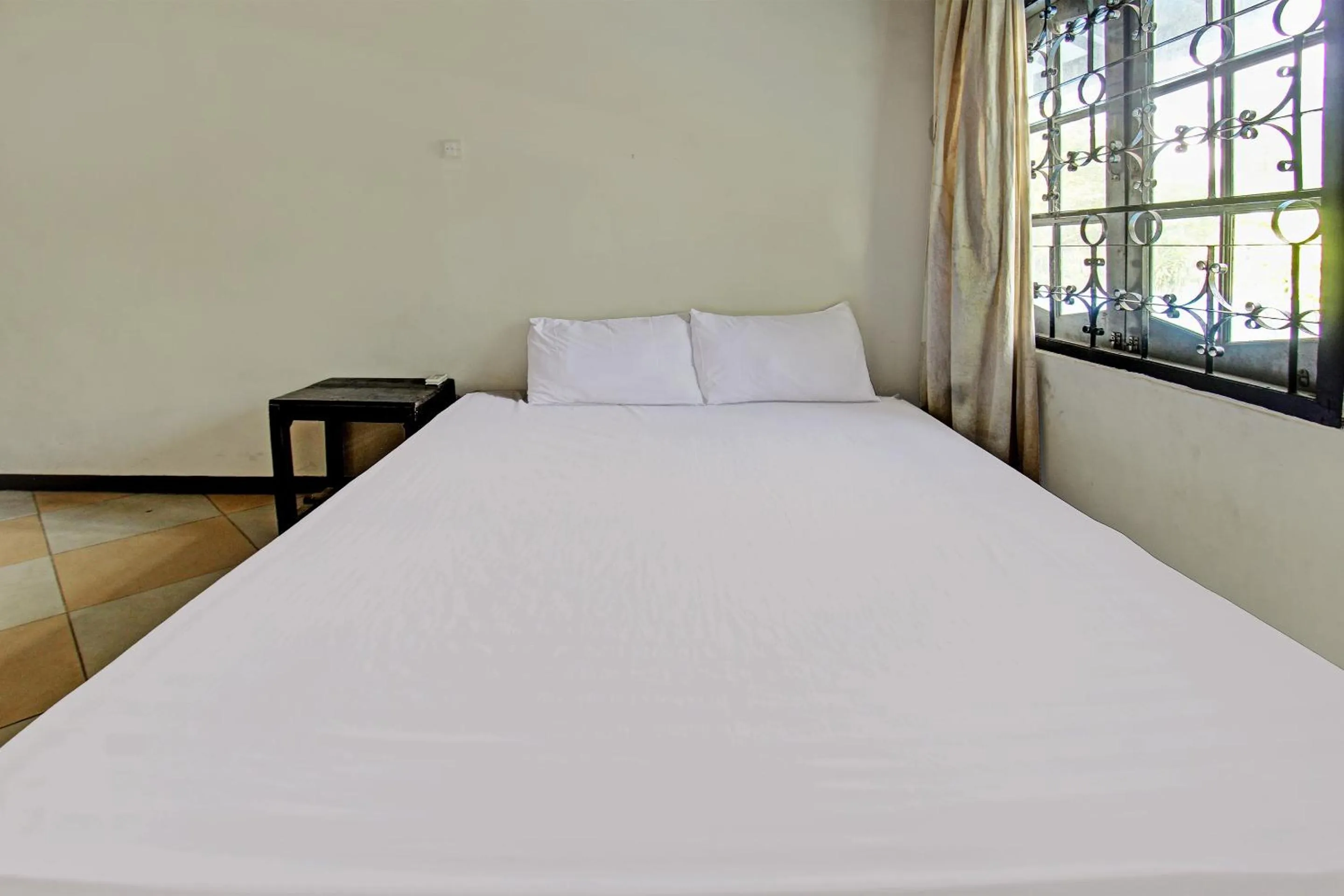 Bedroom in Hotel O Motel Langko