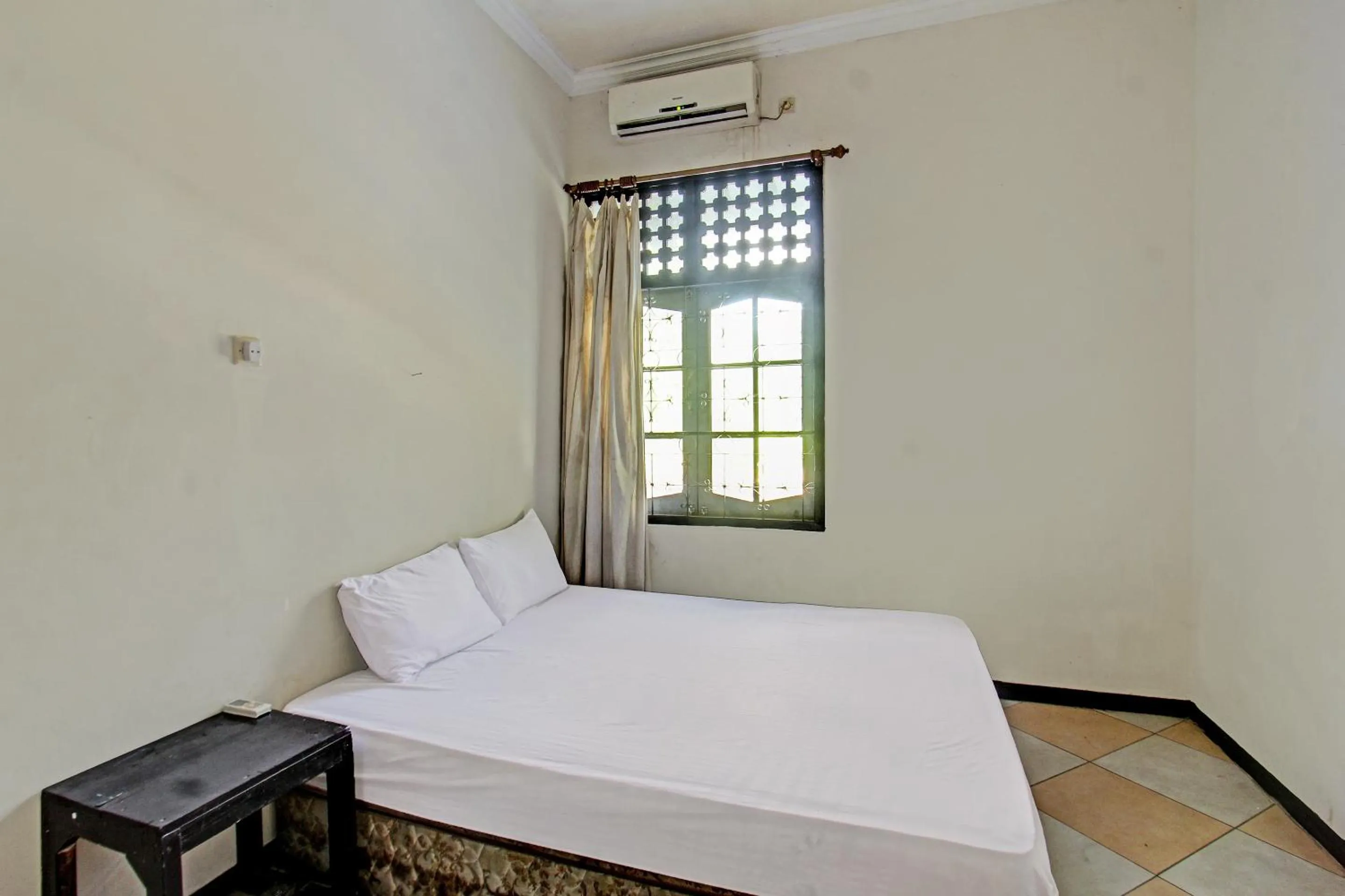 Bedroom in Hotel O Motel Langko