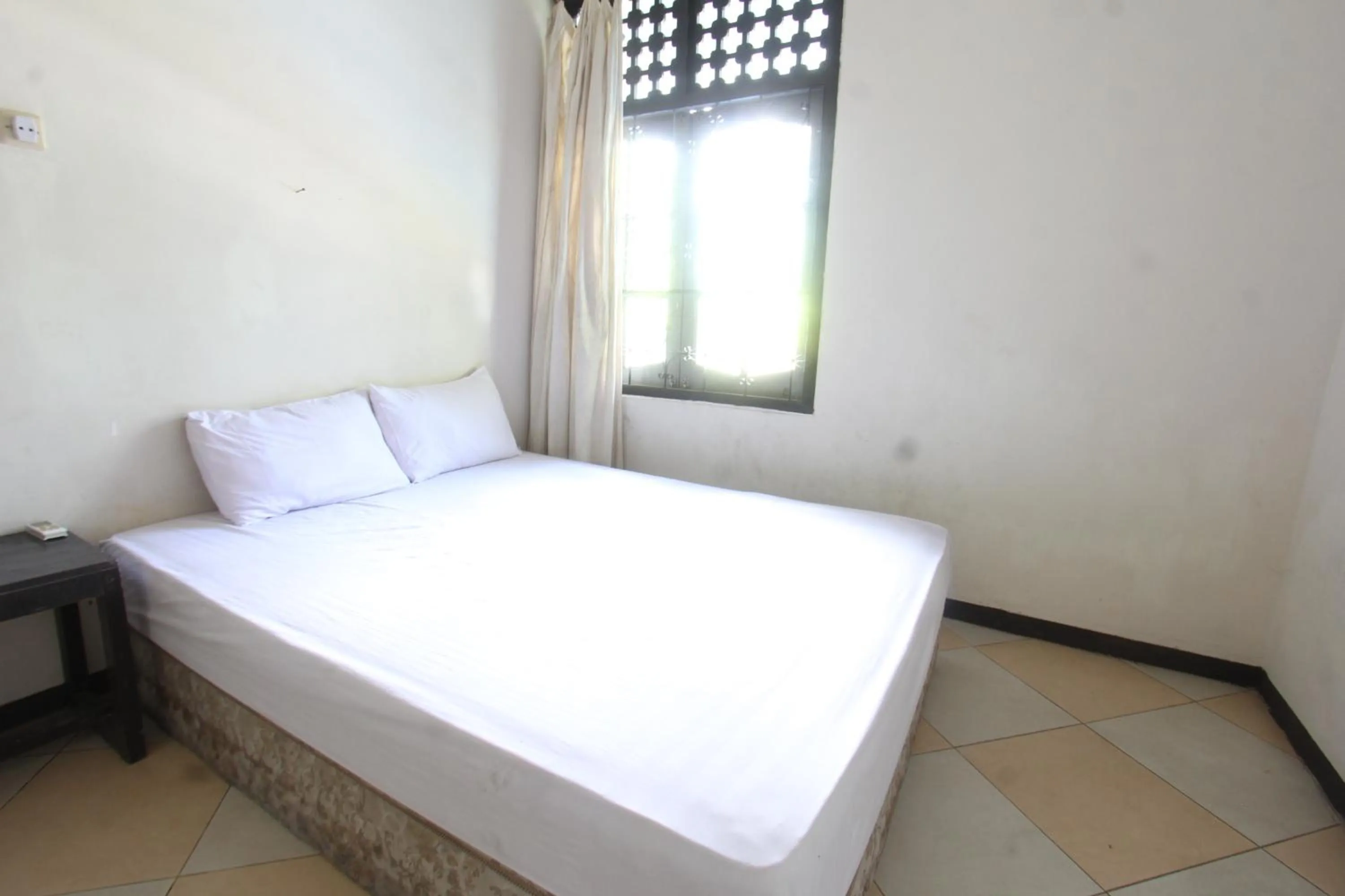 Bedroom in Hotel O Motel Langko