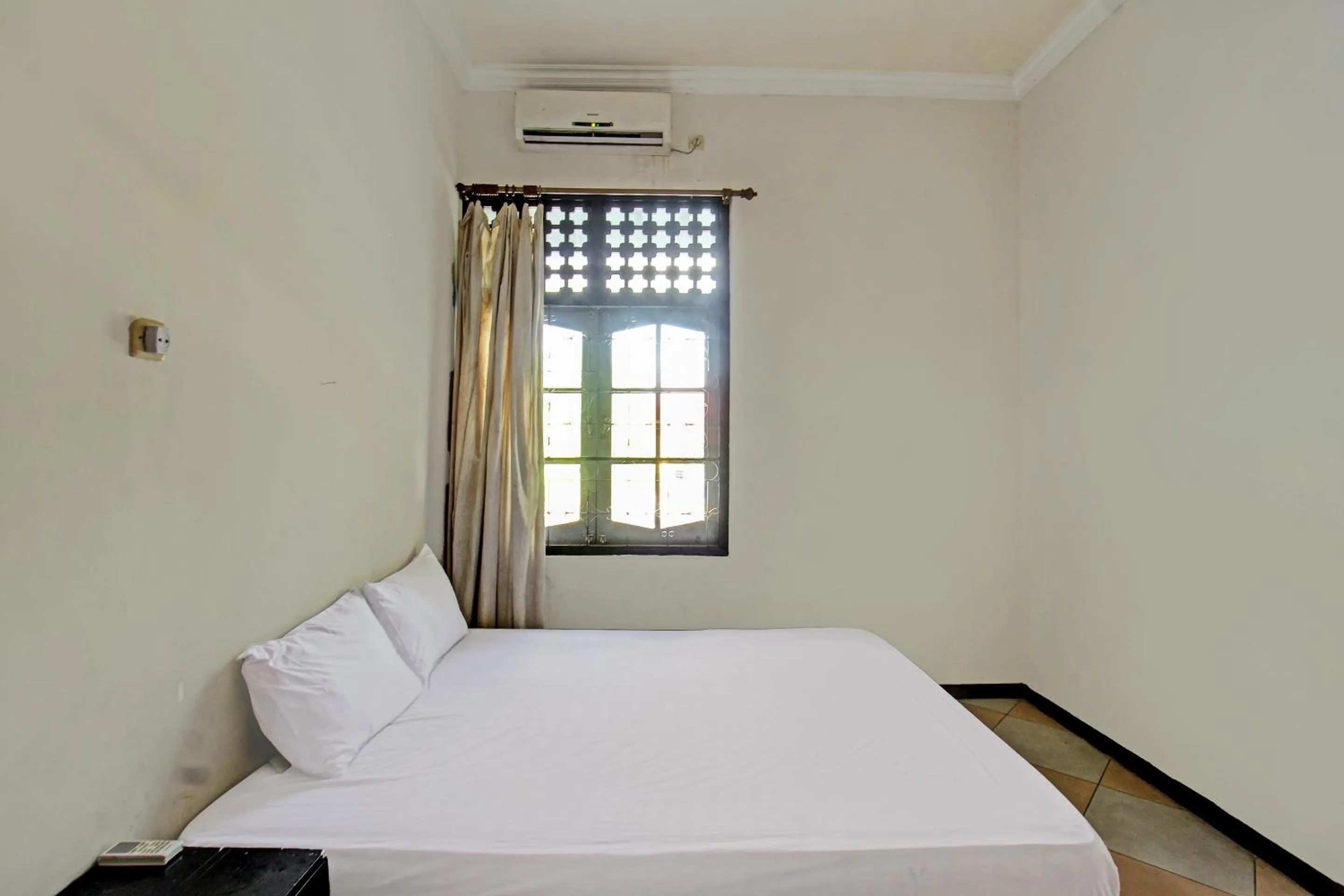 Bedroom in Hotel O Motel Langko