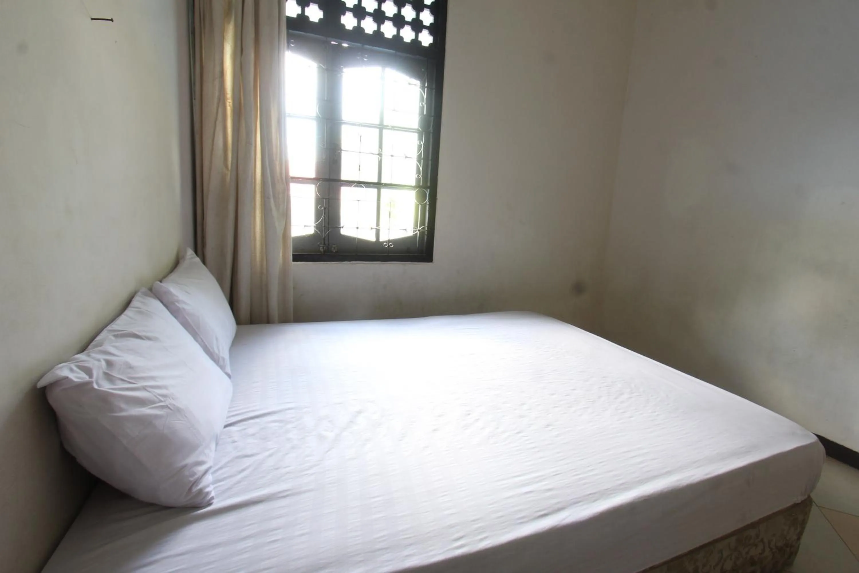 Bedroom in Hotel O Motel Langko