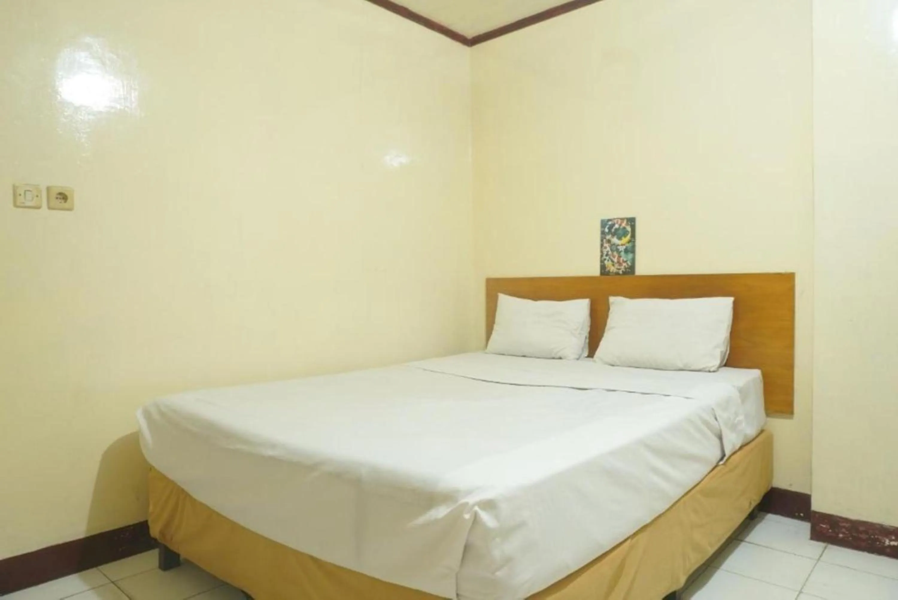 Photo of the whole room, Bed in Hotel O Rumah Massagena Syariah Near Gedung Olahraga Enrekang
